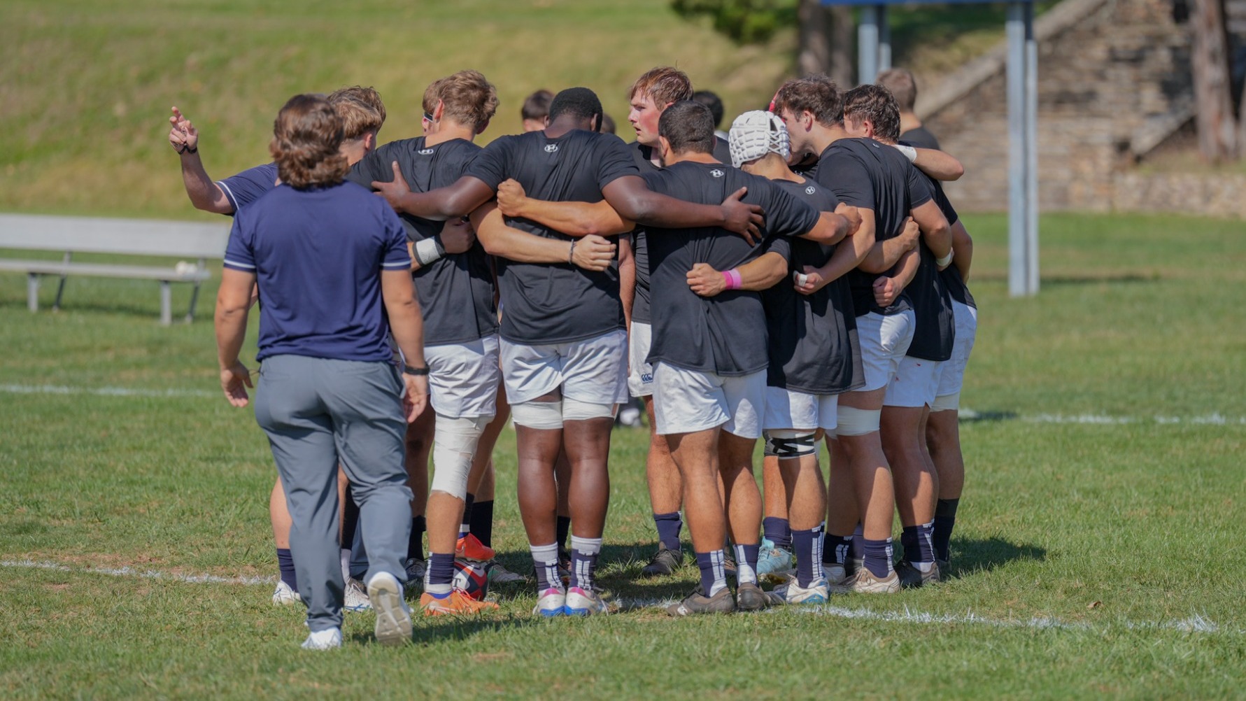 Men's Rugby in a Huddle