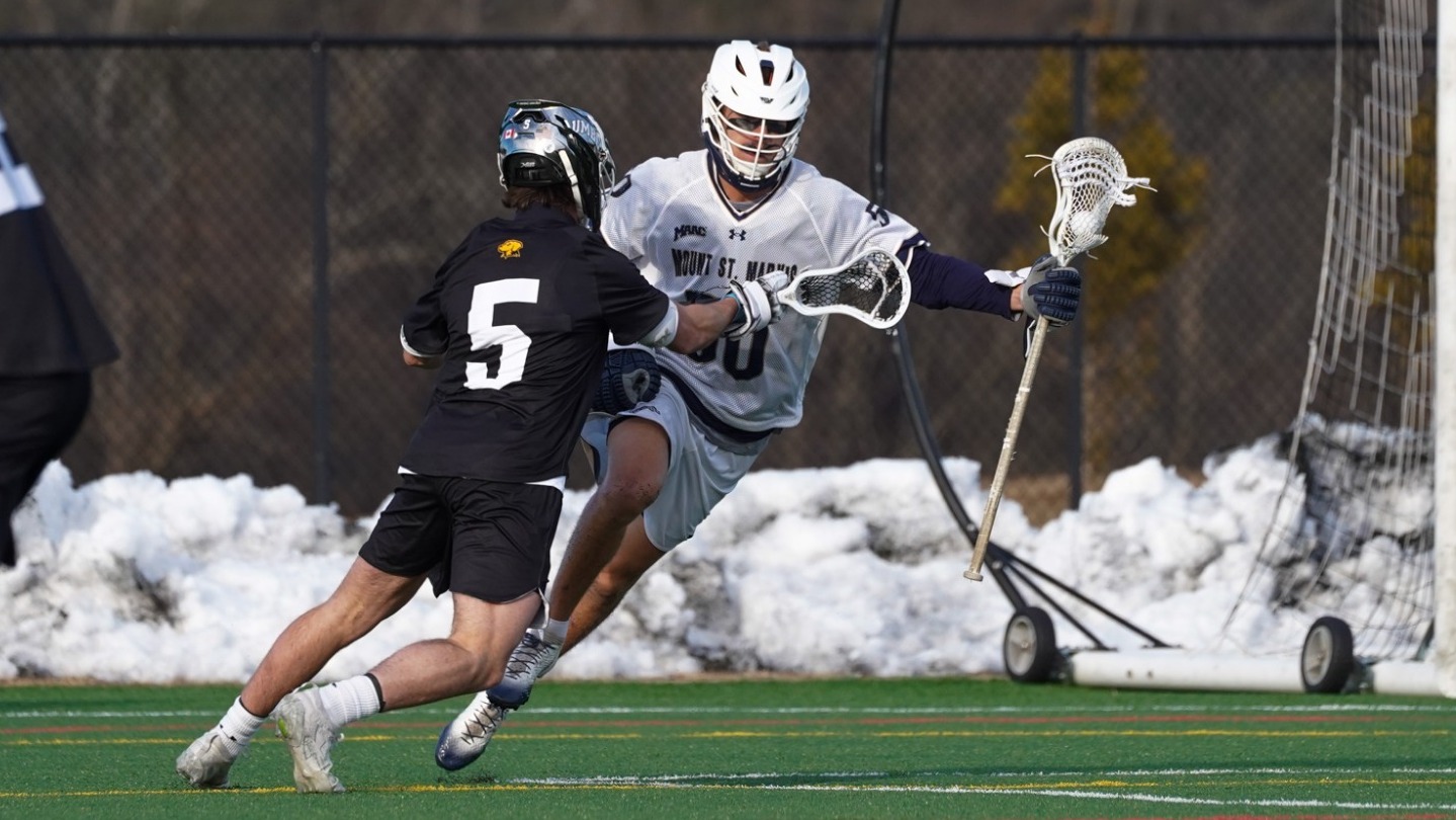 Owen Fasulka Works to Evade a UMBC Defender