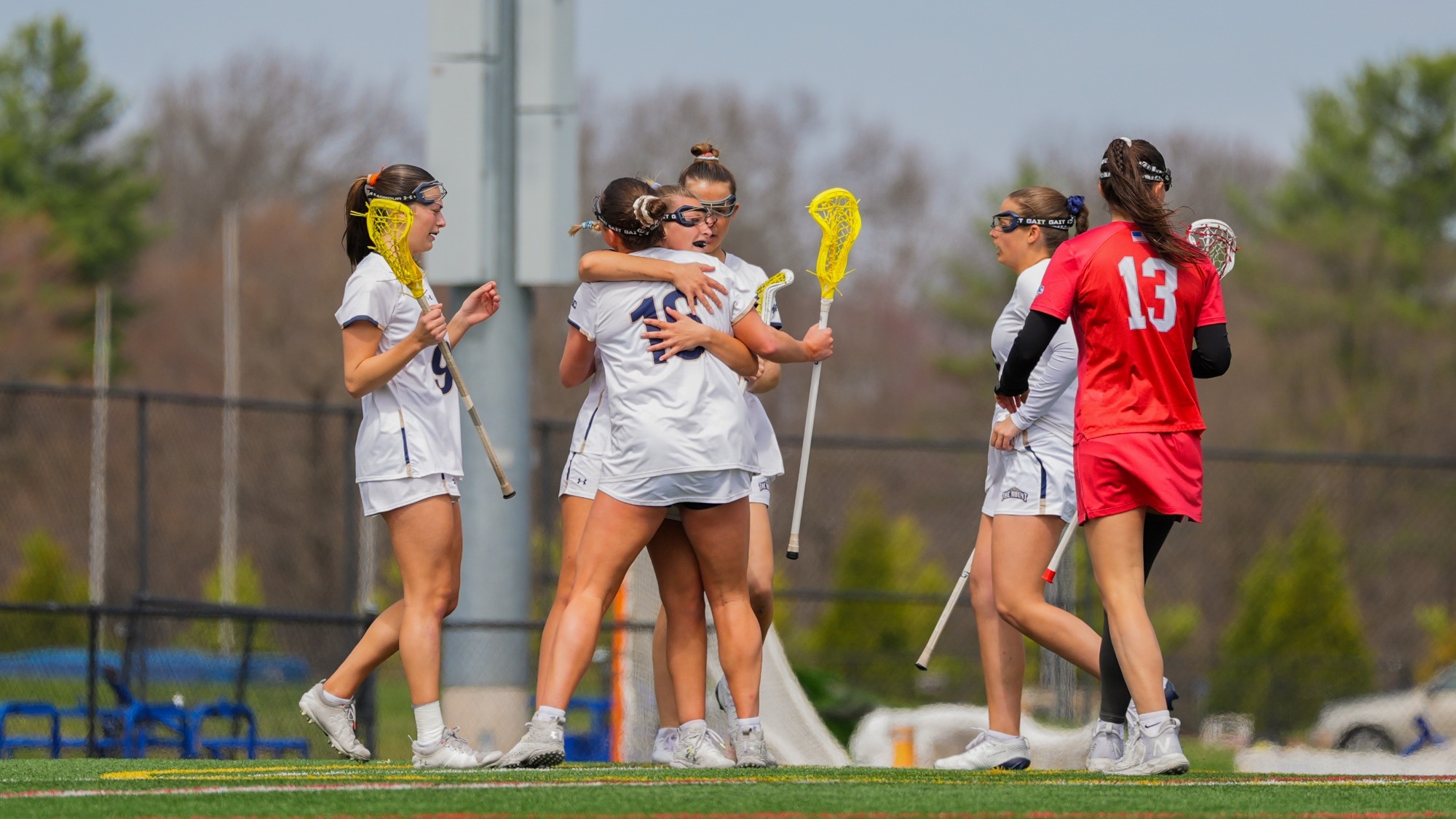 Mount Players Embrace After a Score