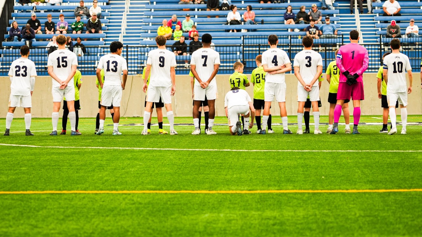 Soccer Team Lines up for National Anthem