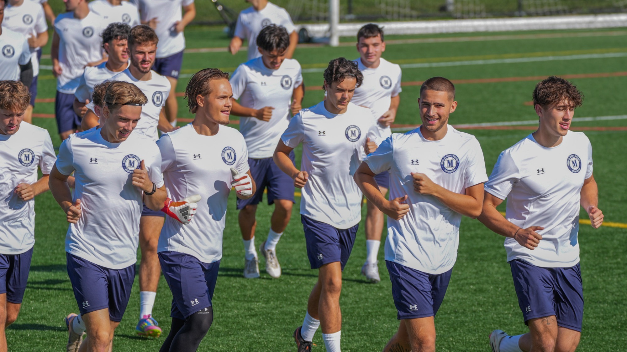 Men's Soccer Players Running Out at Practice