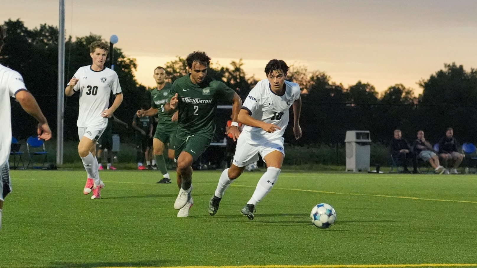 Daniel Morales Silva Dribbling Past a Binghamton Defender
