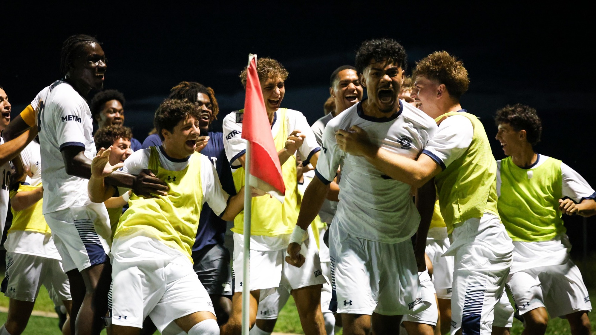 Christian Kyriacou Shouts in Exclamation as his Teammates Celebrate his Goal with him