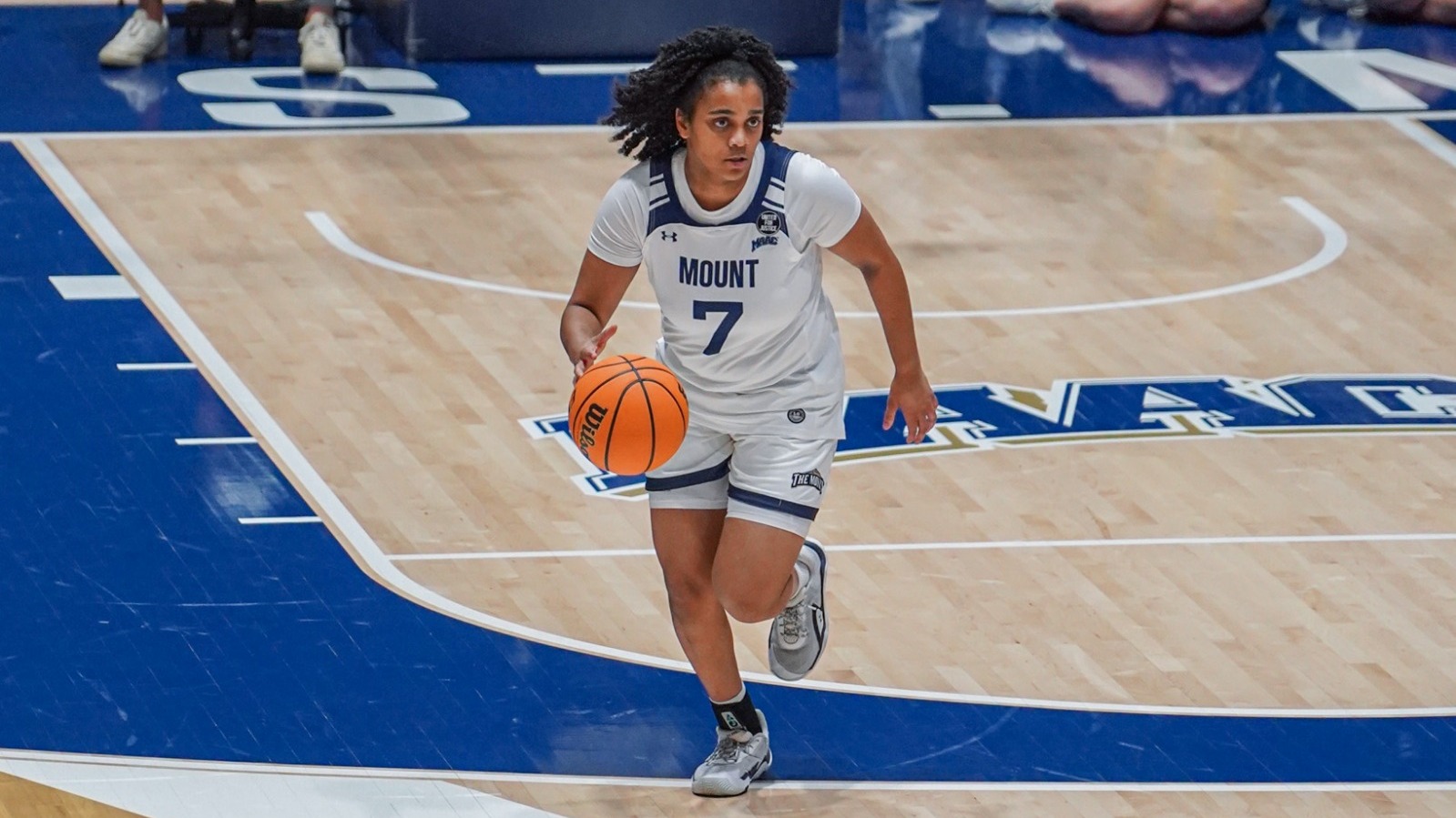 Alana Powell Running Up the Court