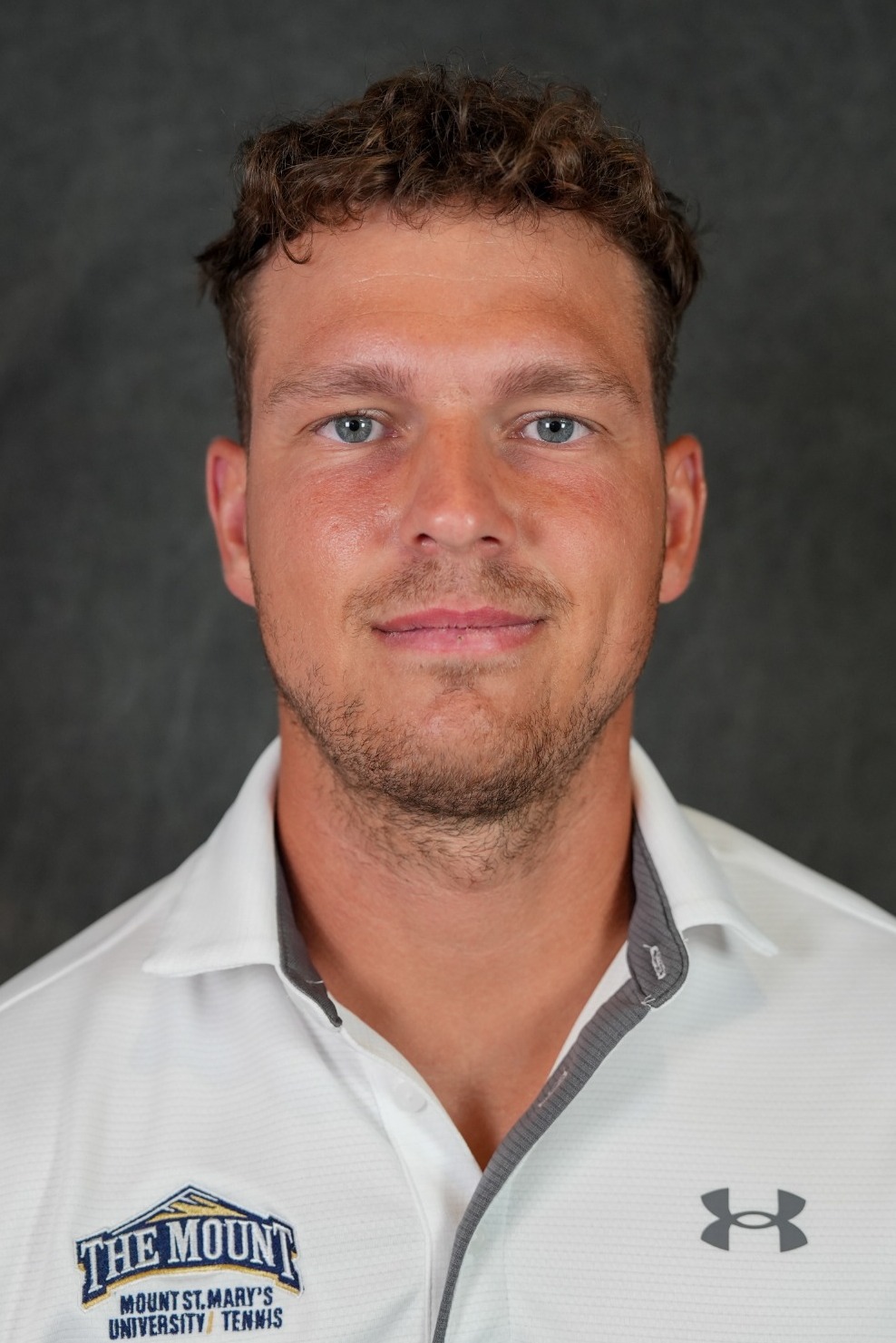 Michal N headshot tennis 26-27