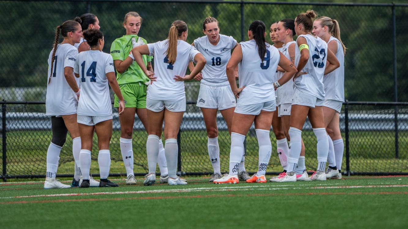 Women's Soccer Huddled During the Match with Richmond