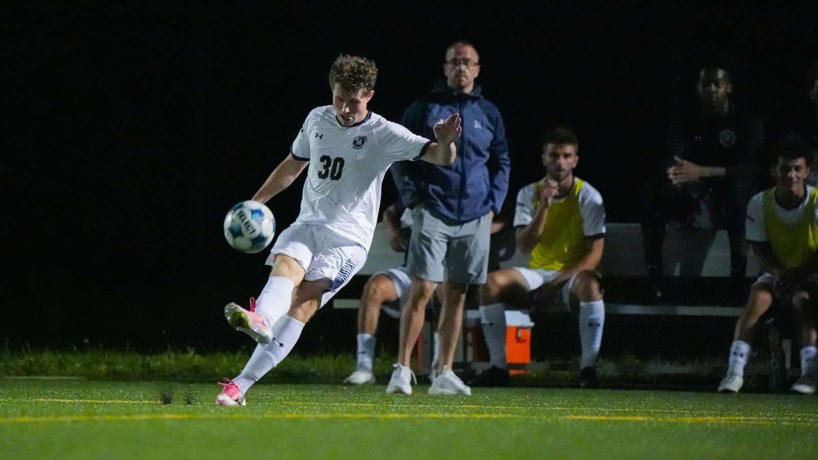 Lincoln Bauer Winds up to Kick and Coach Dany O'Rourke Looks On