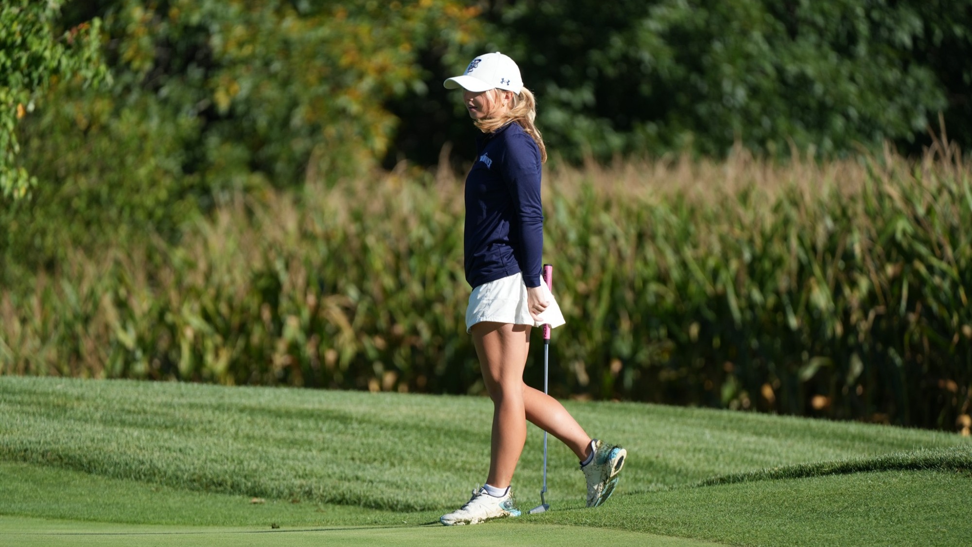 Makenna Kamnikar Standing with Golf Club