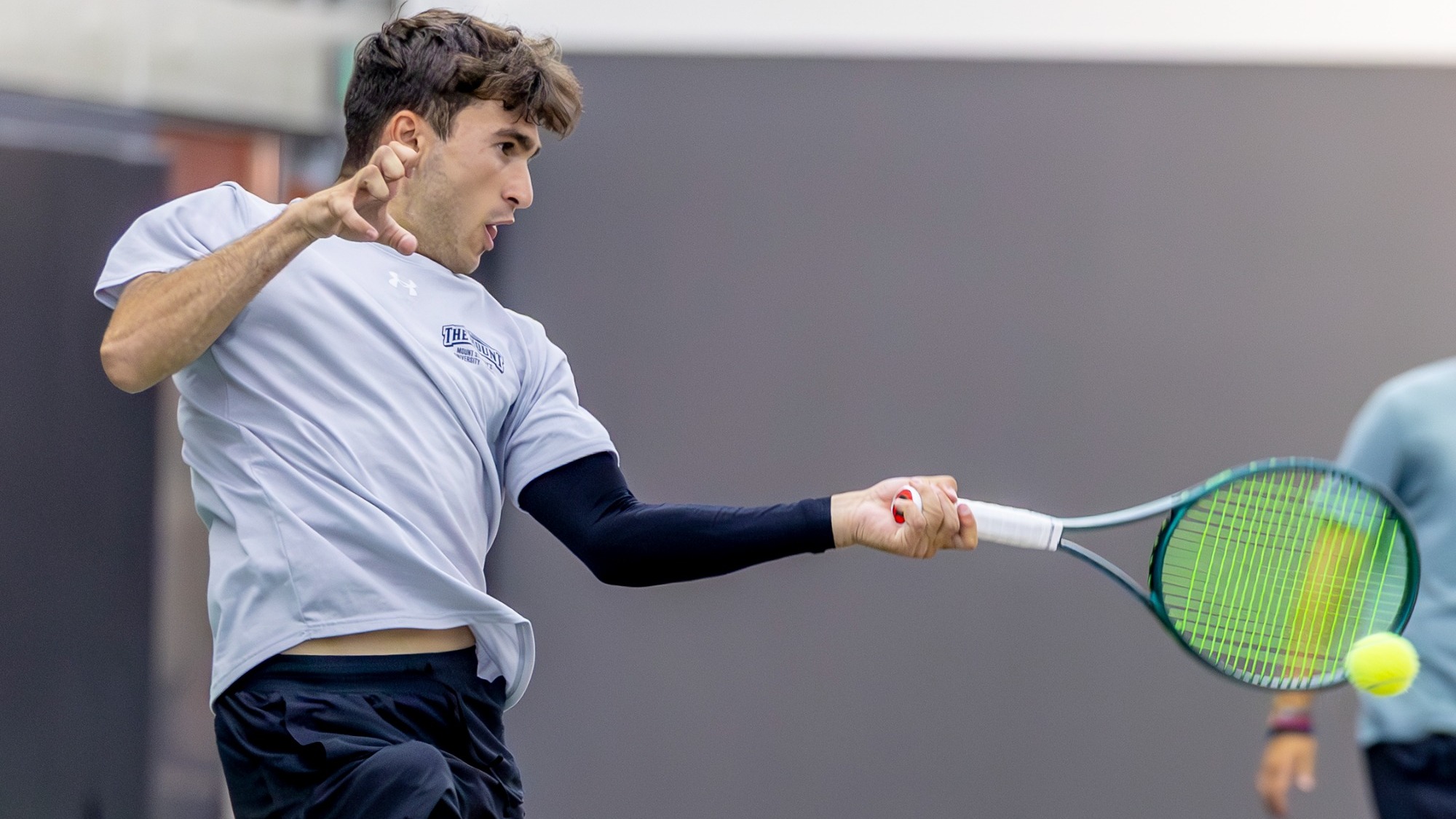Stefanos Pournaropoulos In game hitting tennis ball