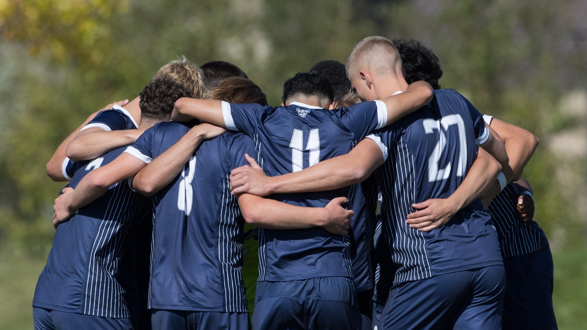Men's soccer team huddle
