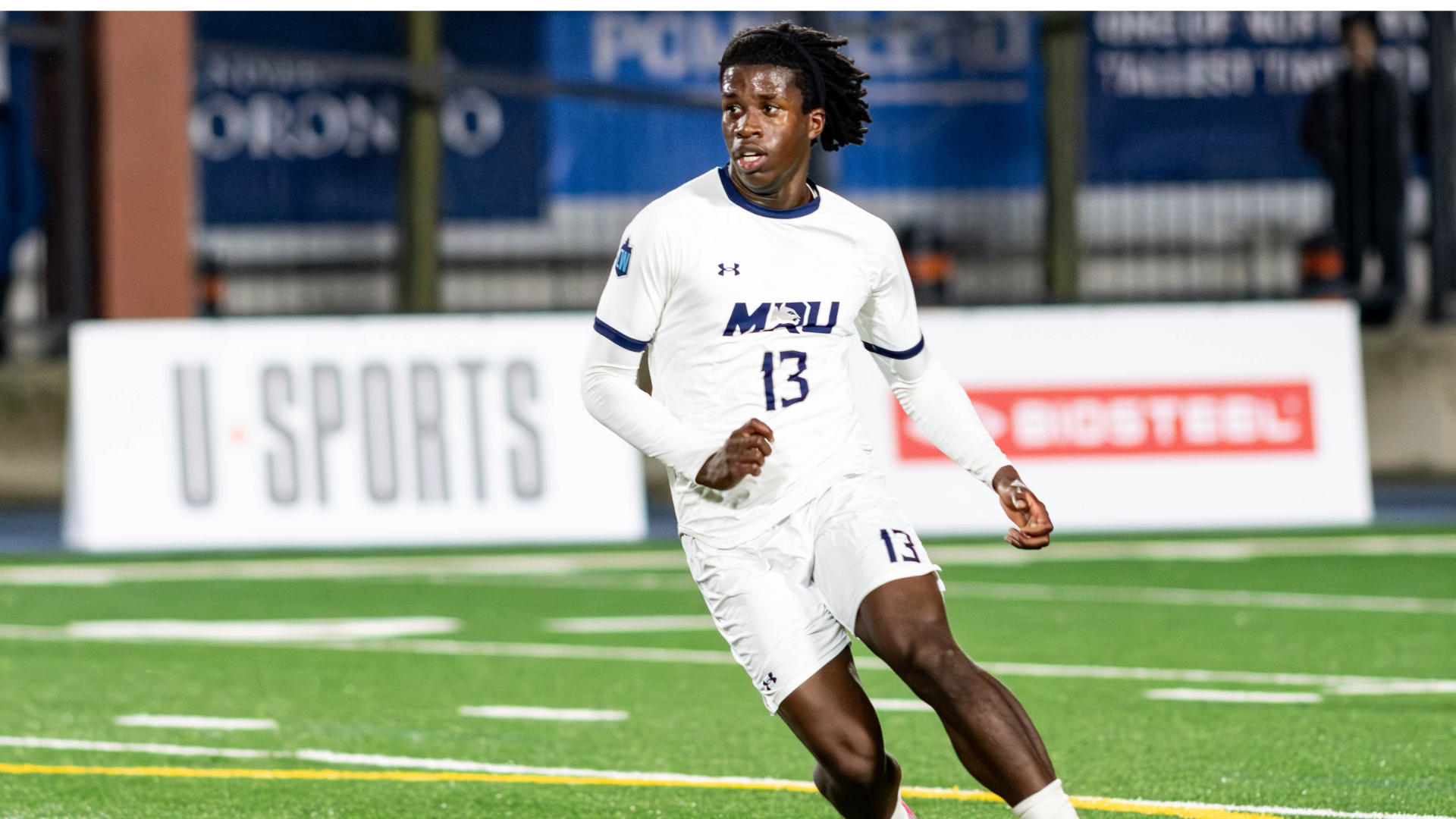 Joseph Green running down the pitch during a match.