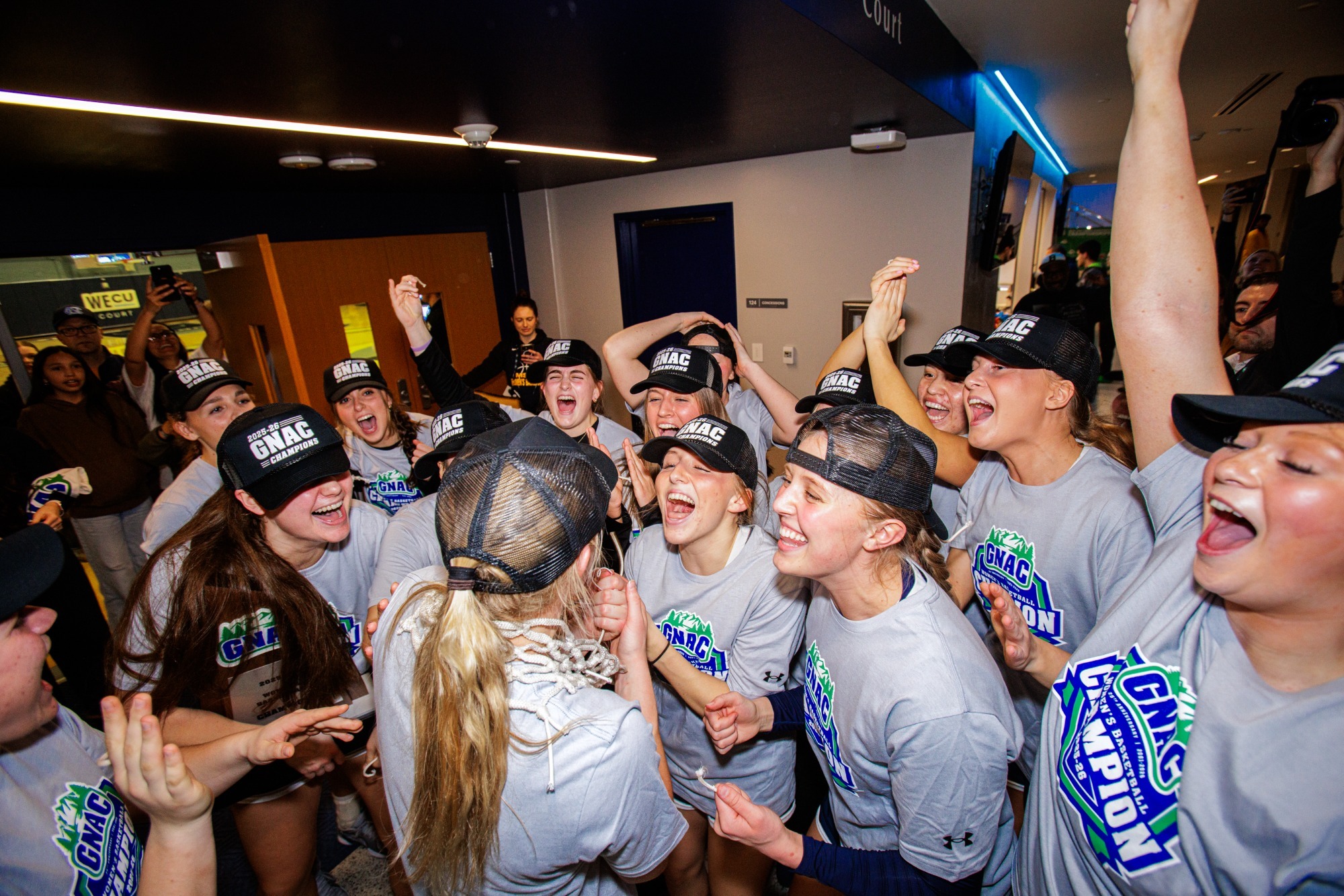 the MSUB women's basketball team celebrates it's 2026 GNAC Championship Victory