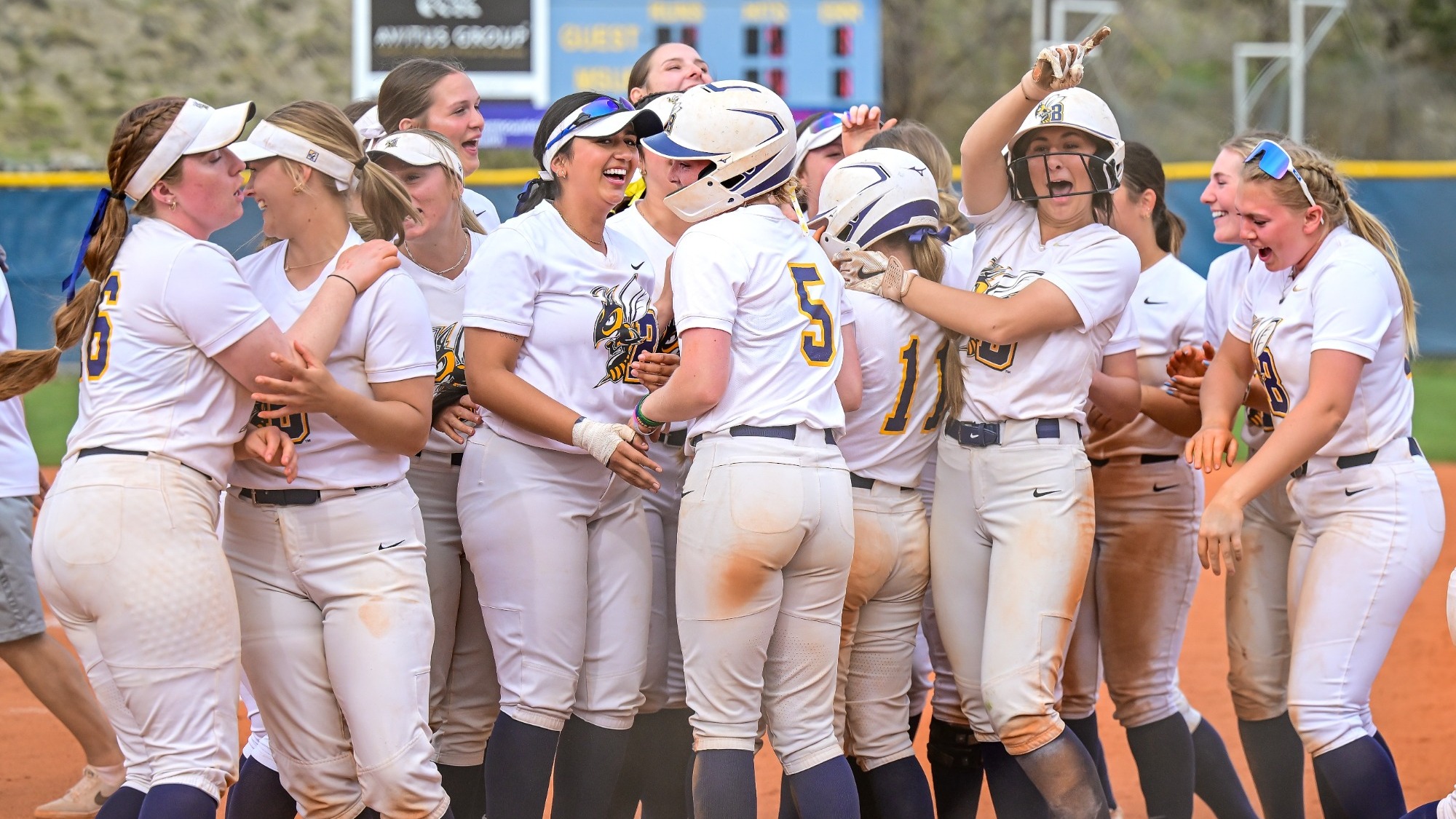 The Yellowjacket softball team celebrates a walk-off, run-rule victory over Western Washington in five innings