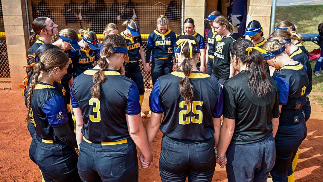 The MSUB softball team huddles pregame before taking the field