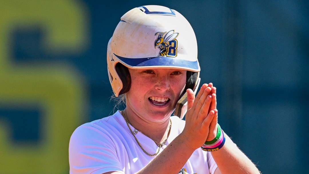 Wynter Hurst celebrates after collecting a hit for the Yellowjacket softball team
