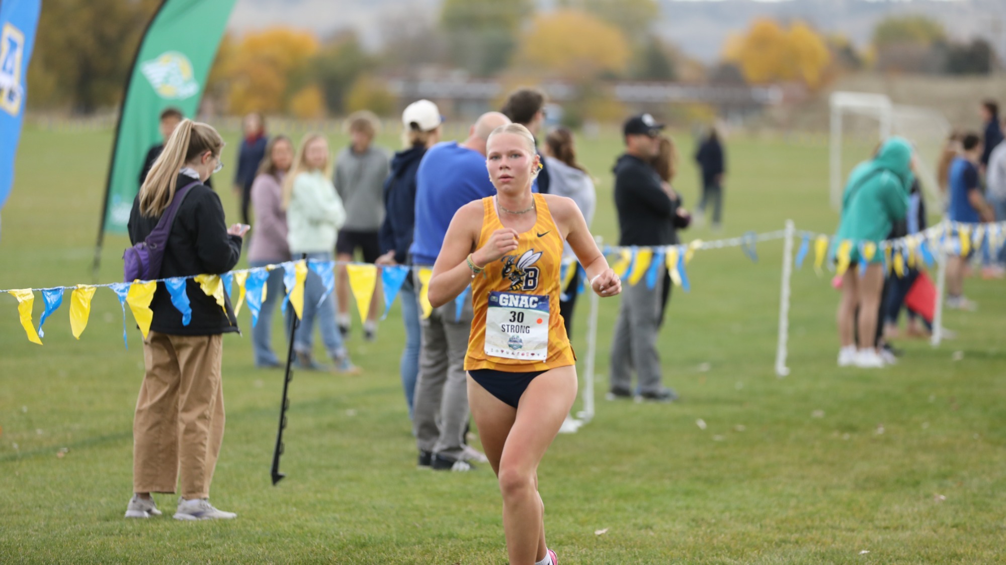Micah Strong runs across the finish line