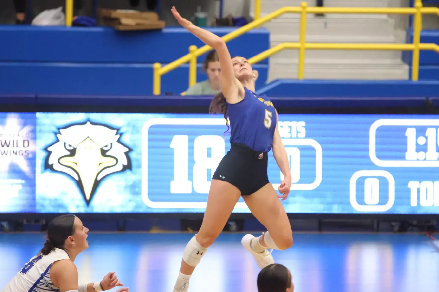 Morehead State's Ella Warrick watches the ball with her right hand in the air as she prepares an attack in the volleyball match versus Michigan State