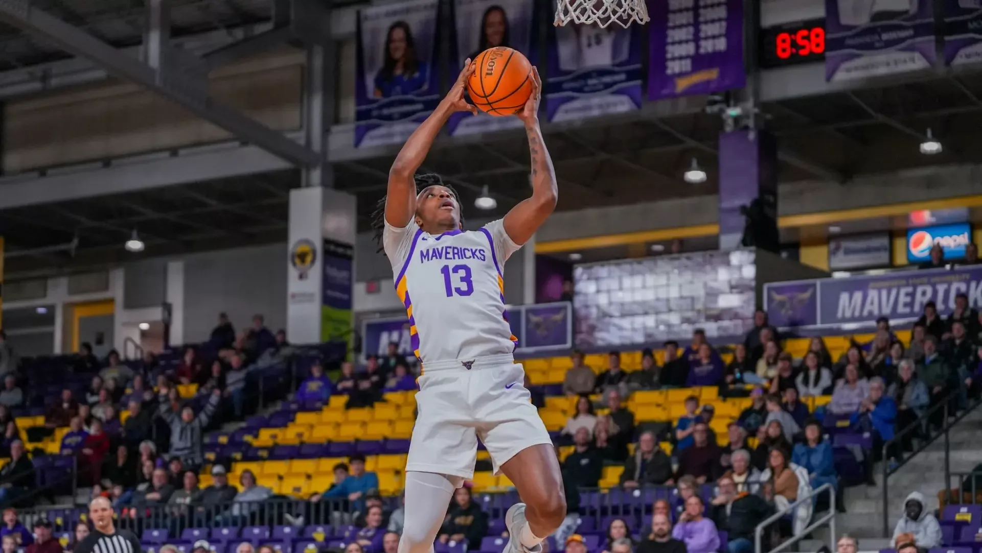 A photo of David Harmon going for the layup vs. Southwest Minnesota State