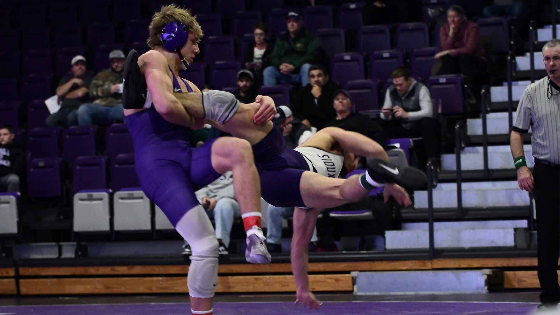 Walker Bents makes a moves on opponent to gain takedown.