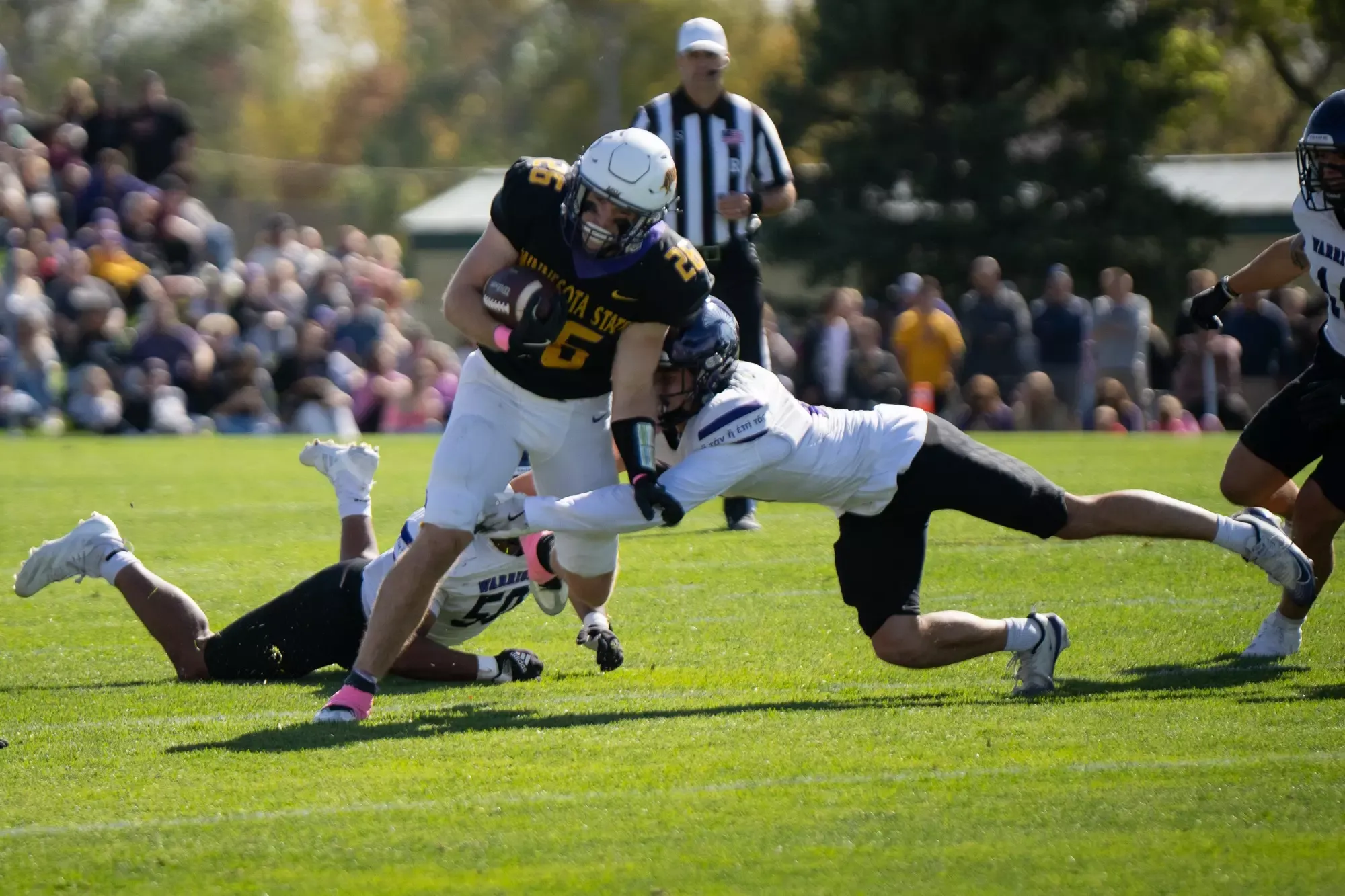 Carter Henderson rushing with the ball vs. Winona State