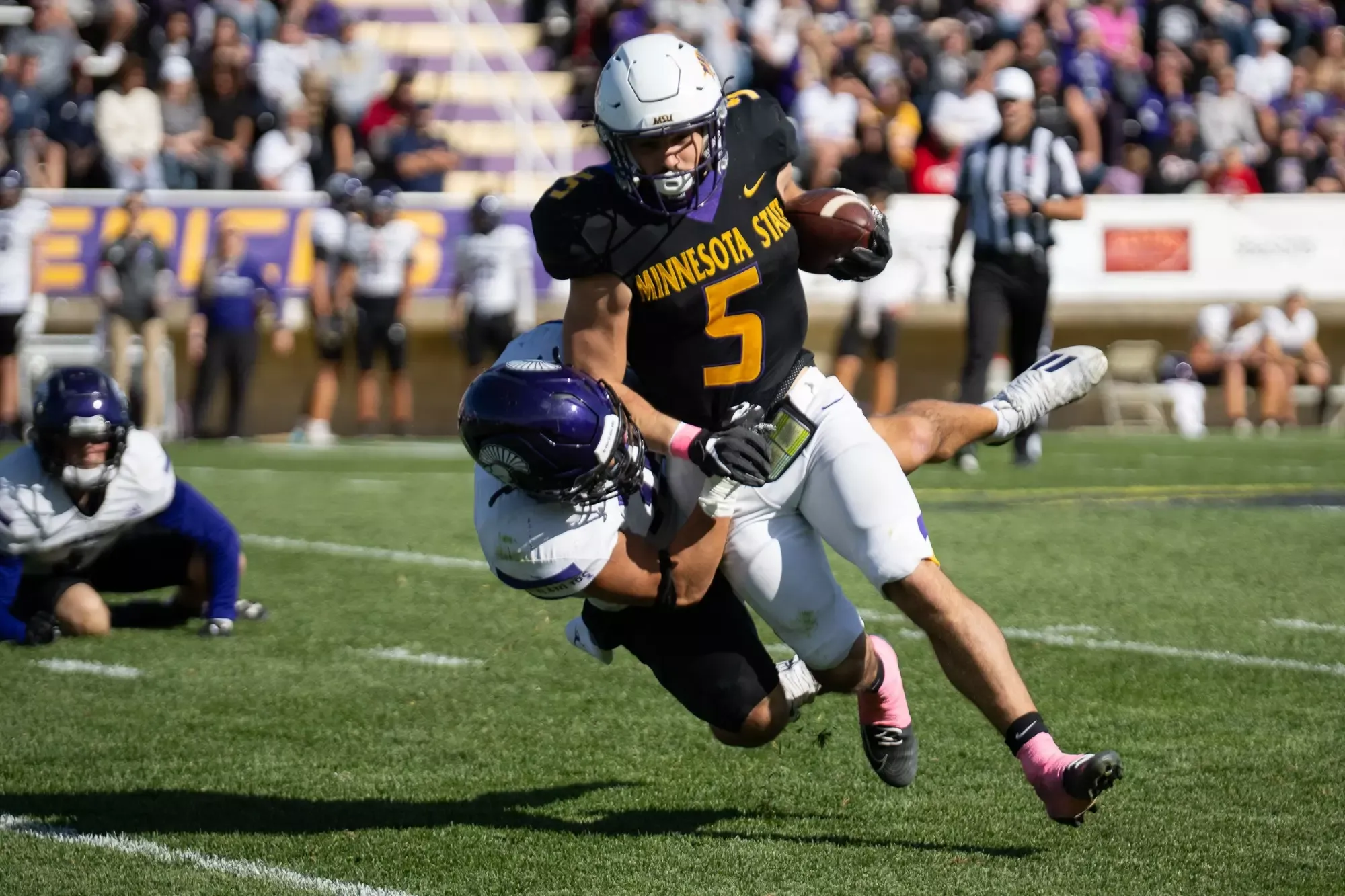 Sam Backer breaking a tackle vs. Winona State