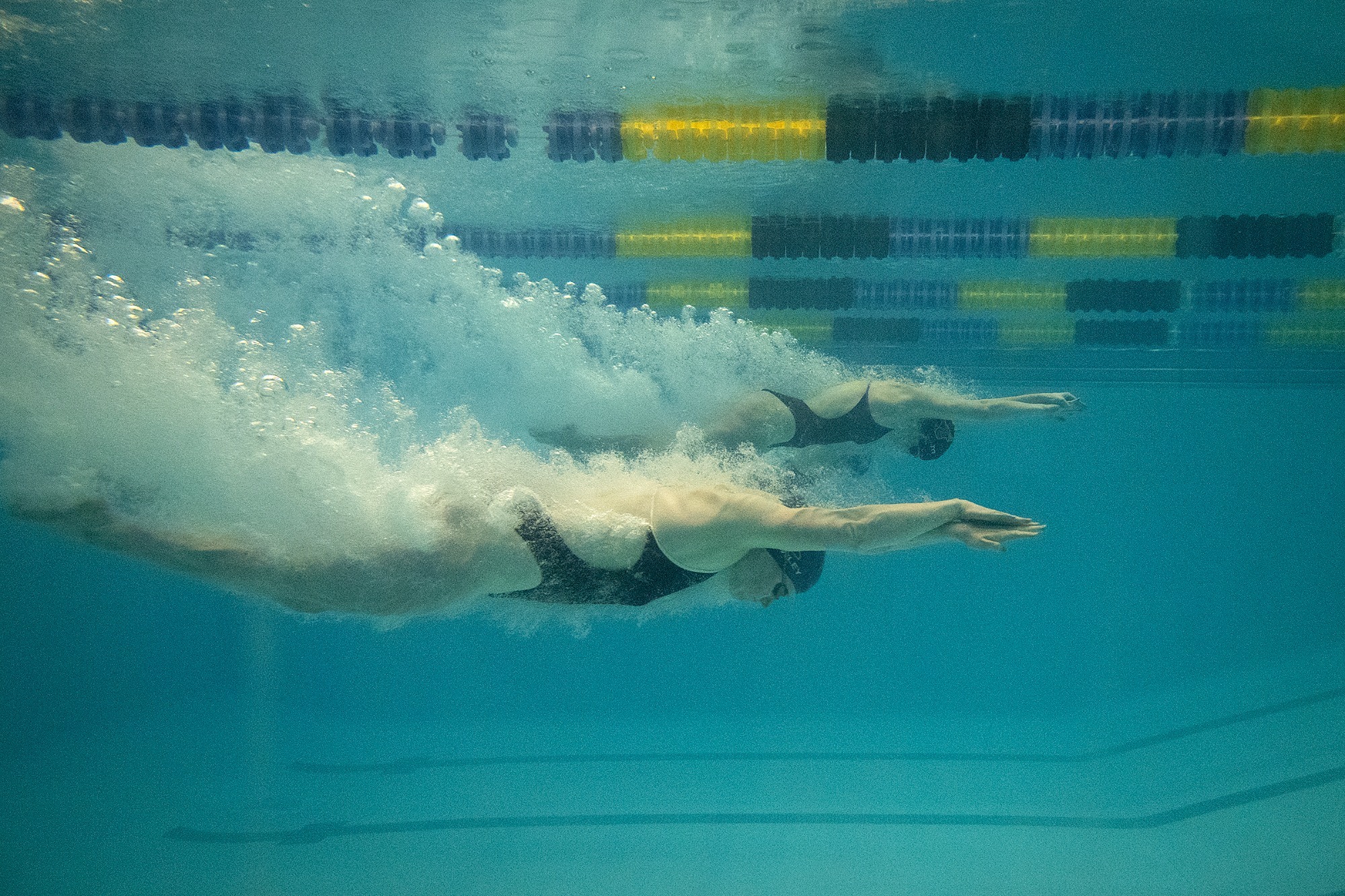 A photo of Maverick swimmers under water at Highland Pool