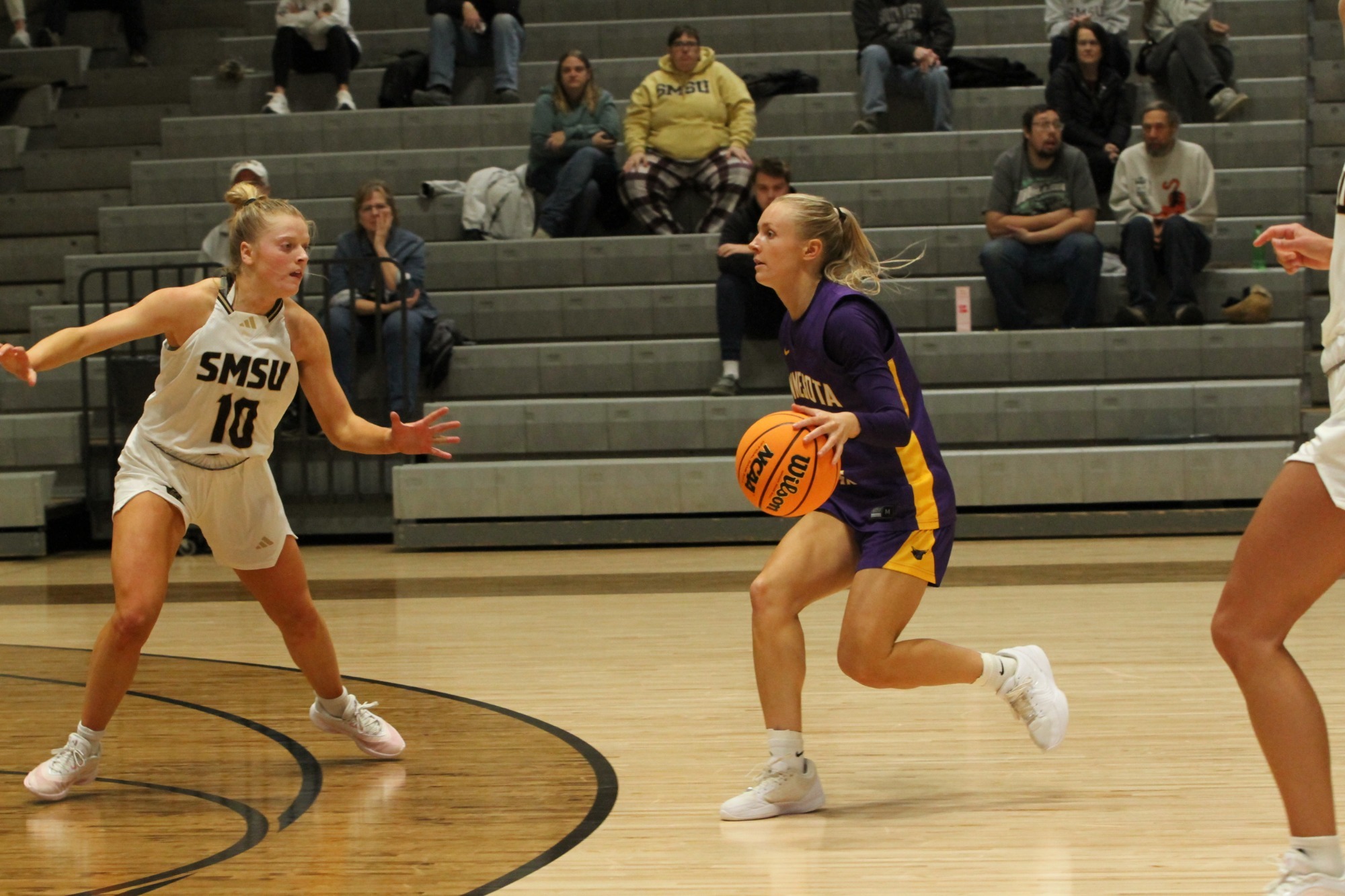 Adeline Kent dribbling with the ball vs. Southwest Minnesota State