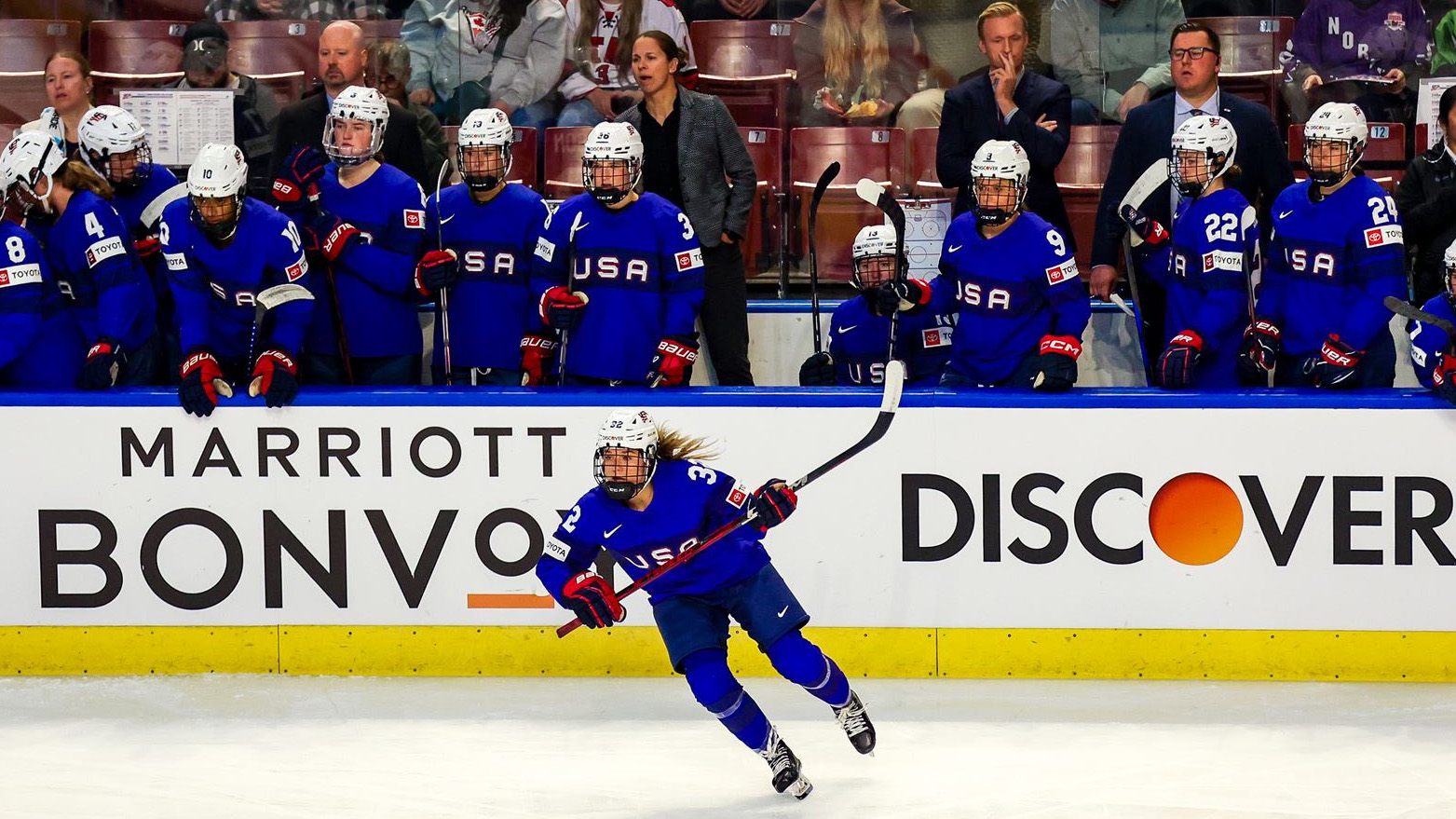 Minnesota State head women's hockey coach watches as team USA takes on Canada in a rivalry series game.  Dickerman also serves as an assistant for the USA Senior National Team. 