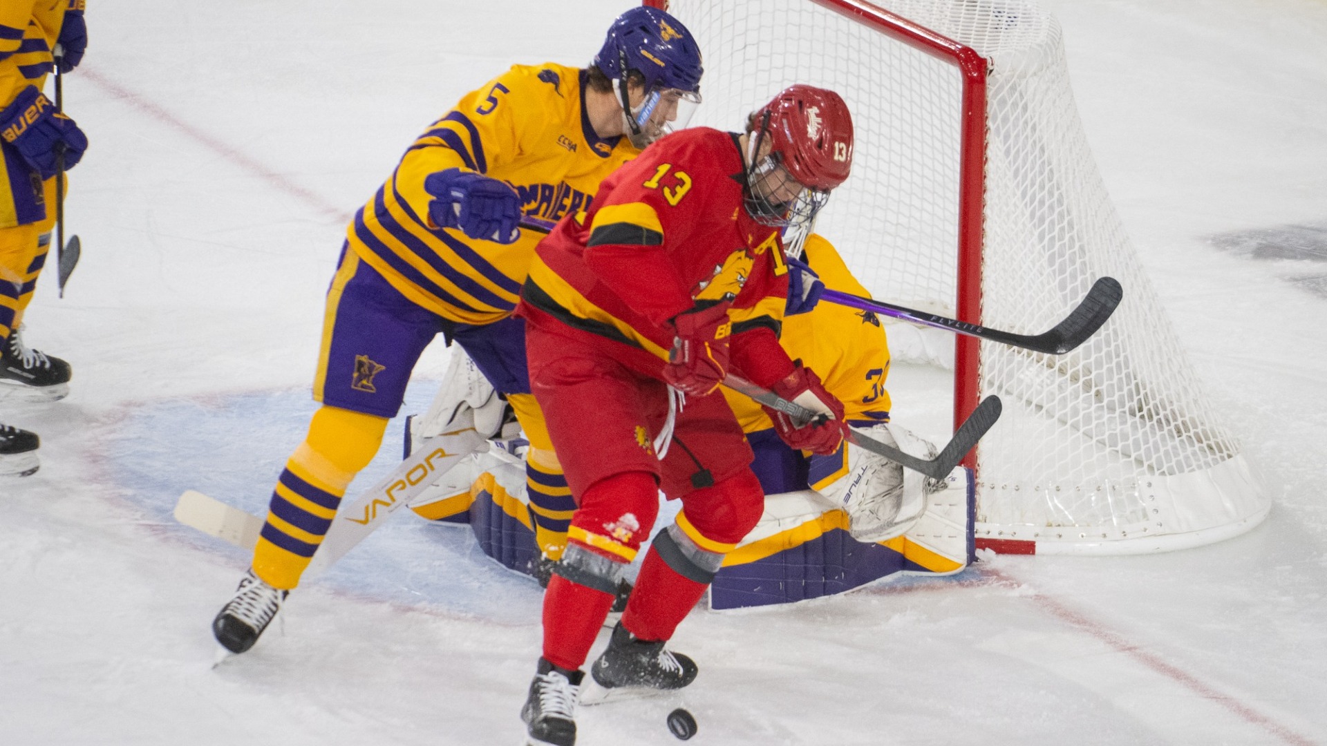Mason Wheeler clears out a FSU player in front of the goal.