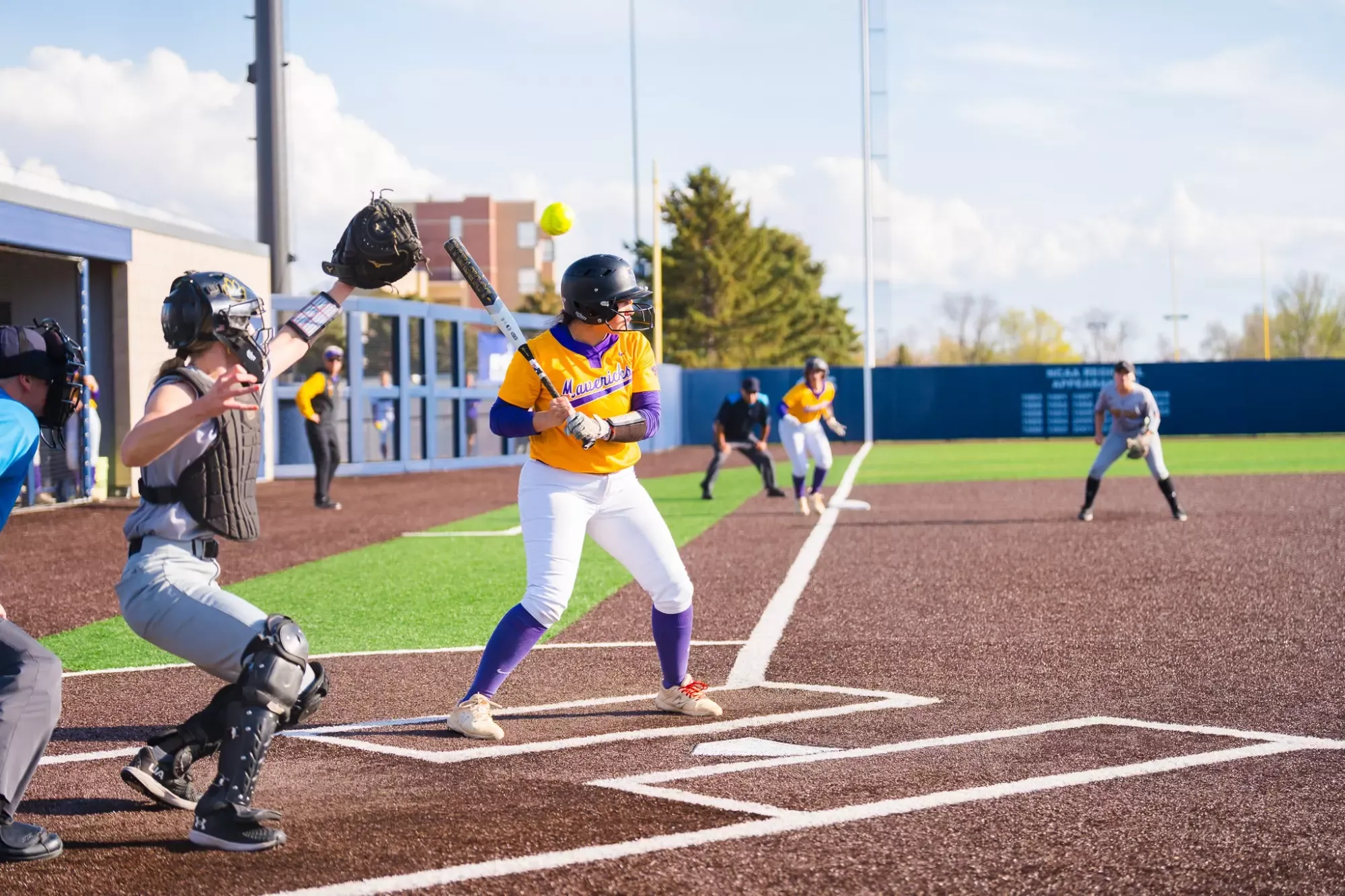 Gianna Lara at the plate watching a ball go past