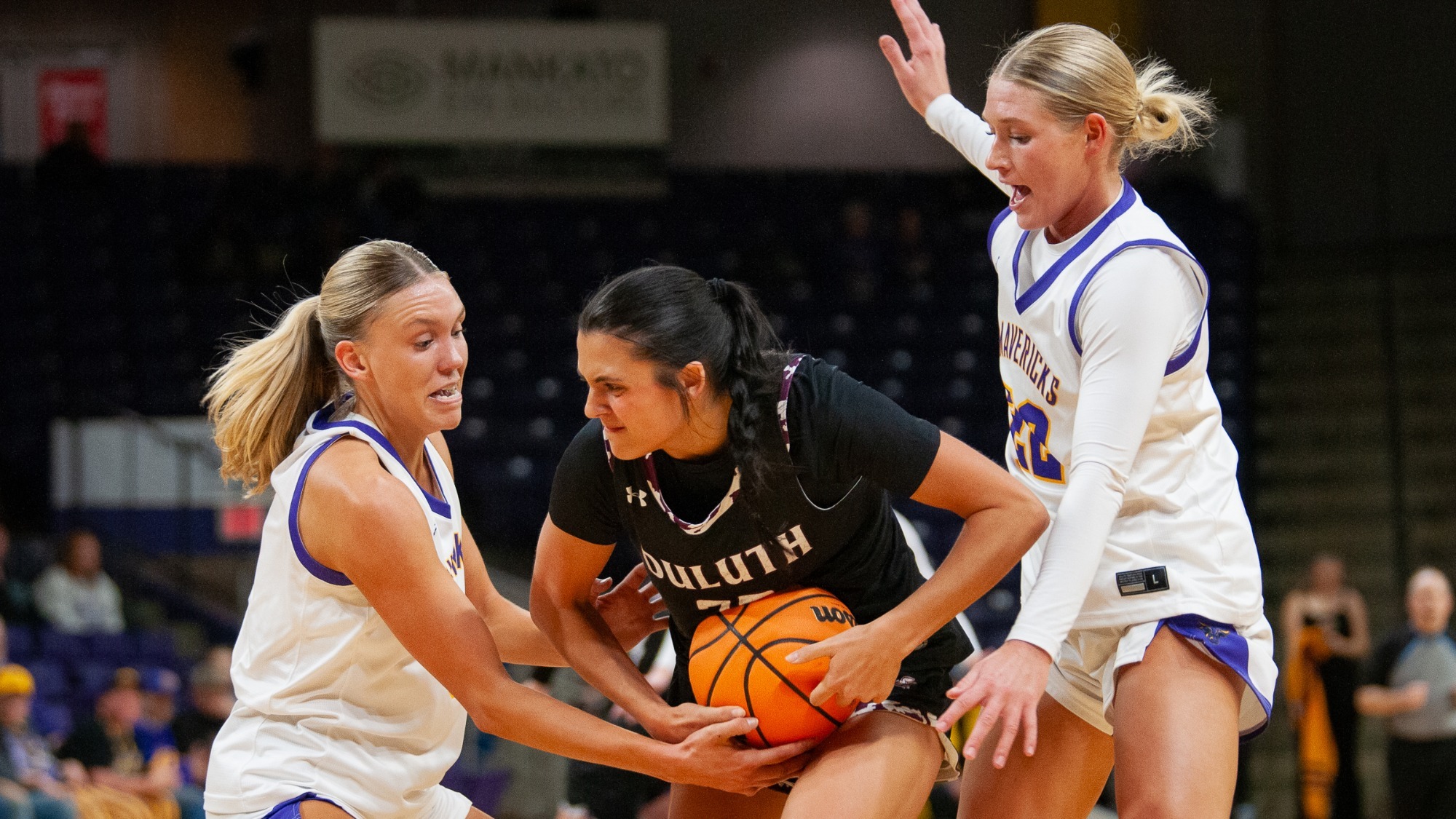 Natalie Bremer and Mackenzie Schweim double team a defender in Minnesota State's win over Minnesota Duluth (1.17)