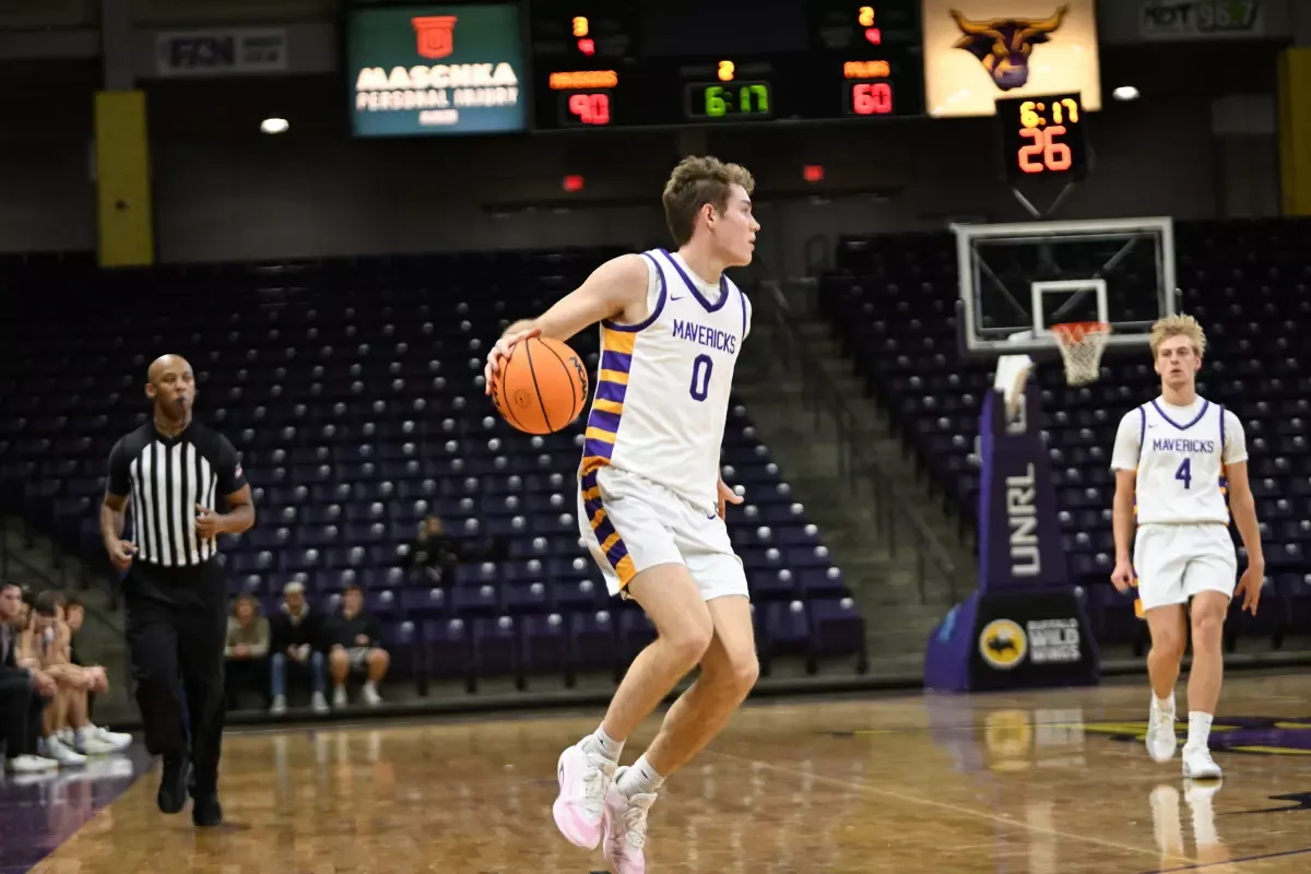 Carson Schweim with the ball against Crown College