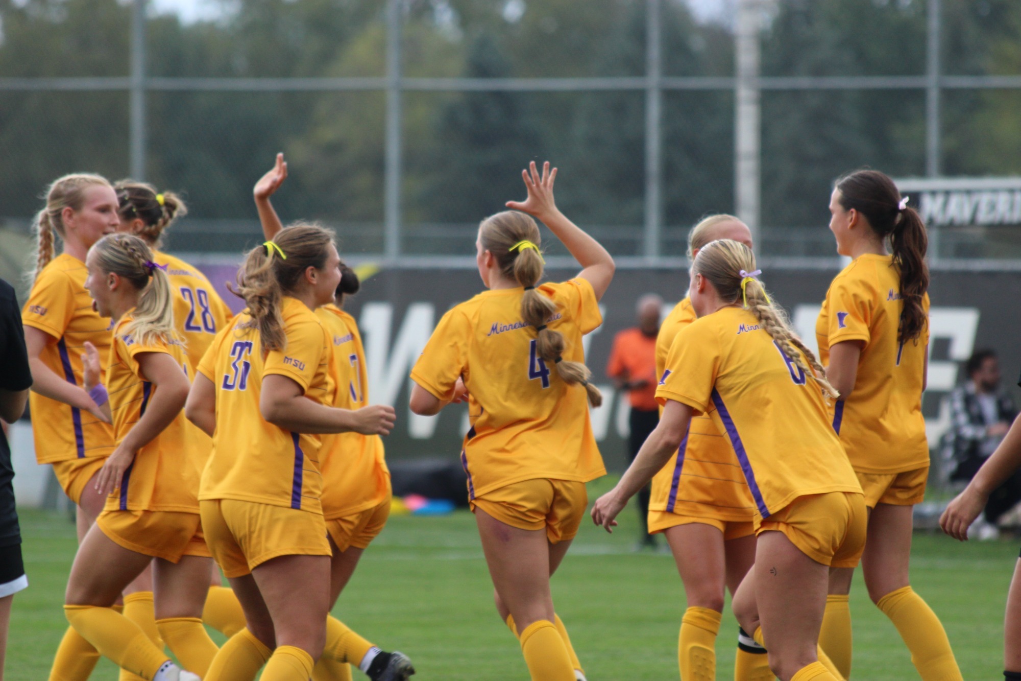 Mavericks celebrate a goal as a team
