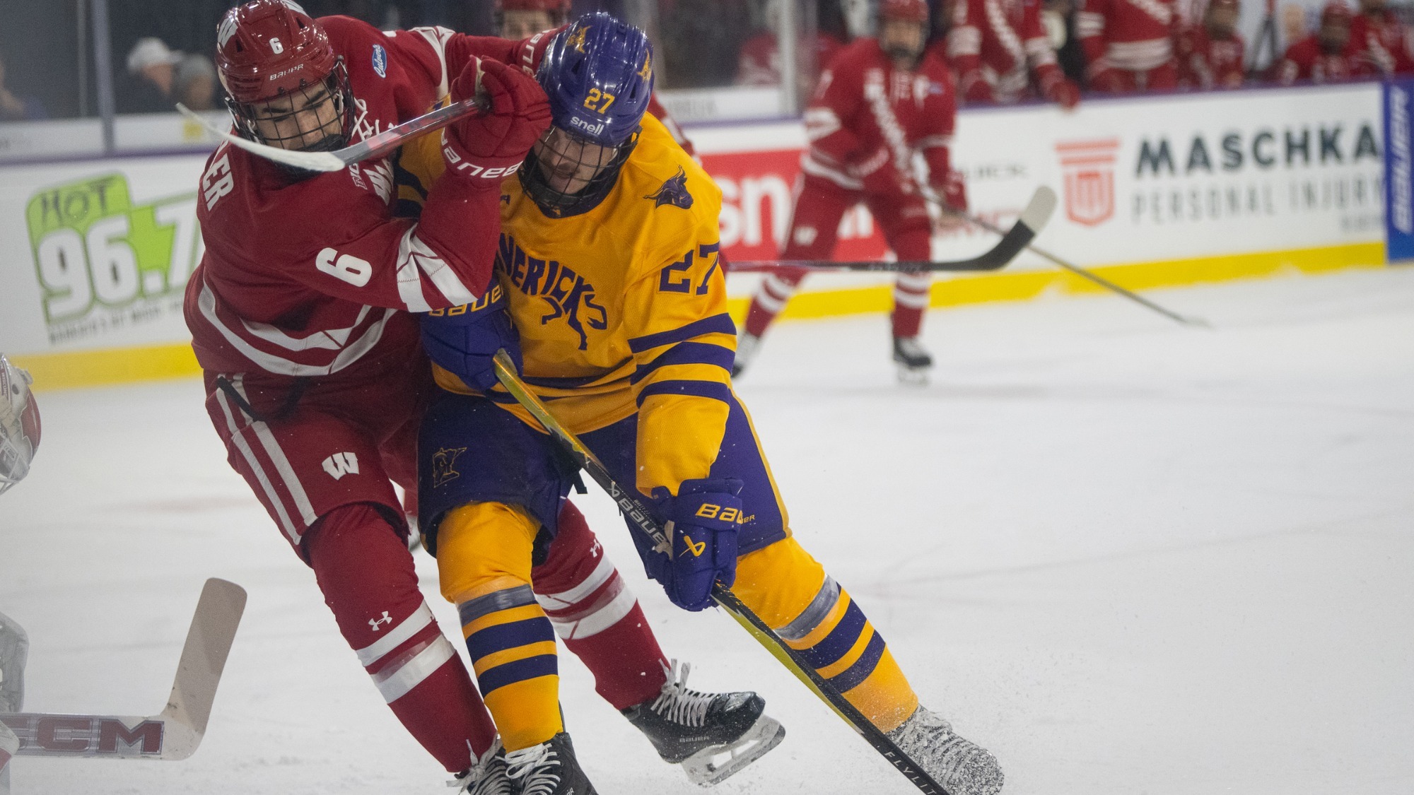 Liam Watkins battles for a puck during MSU's game against Wisconsin (10/10)