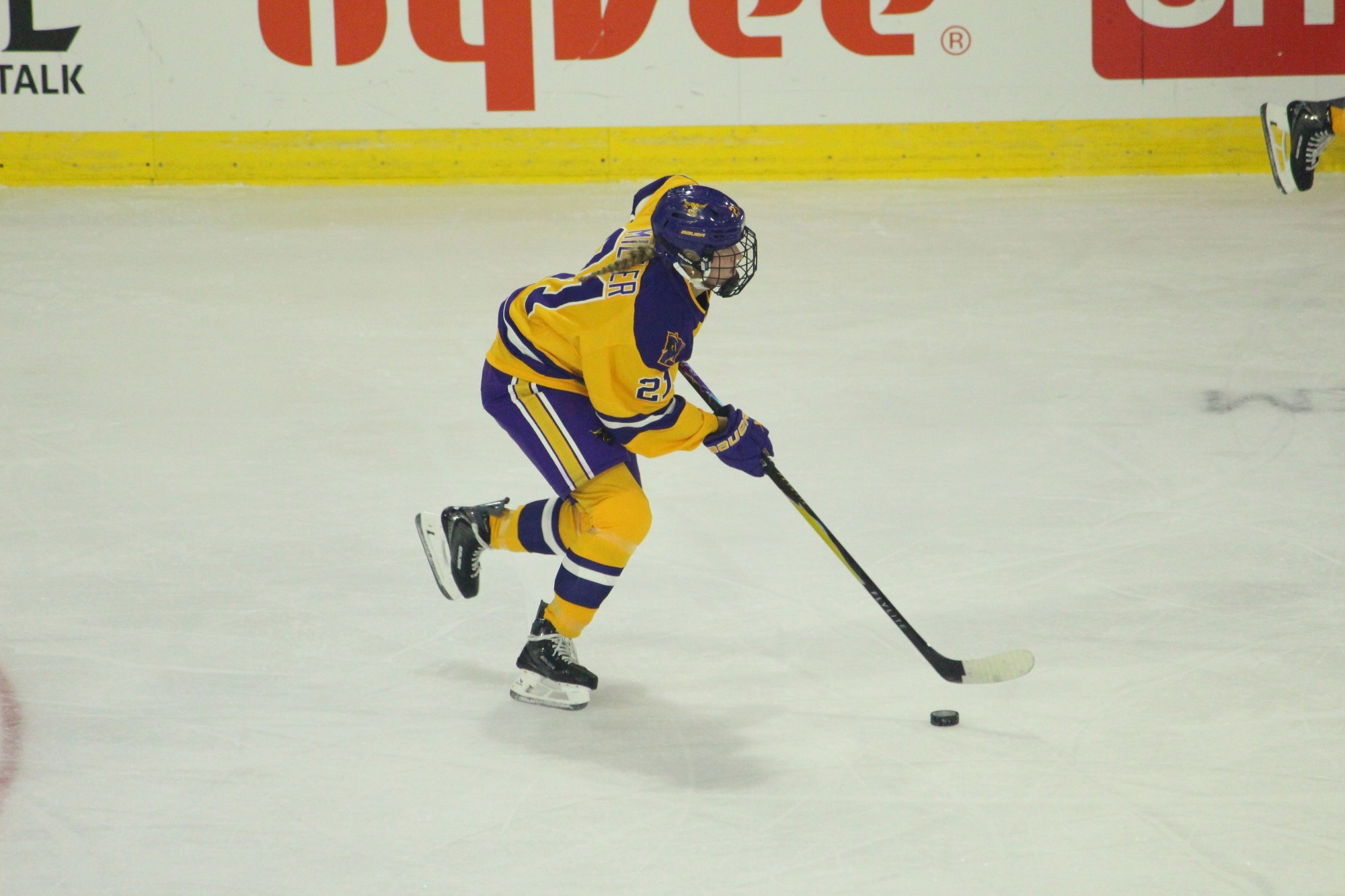Mia Miller skates with the puck