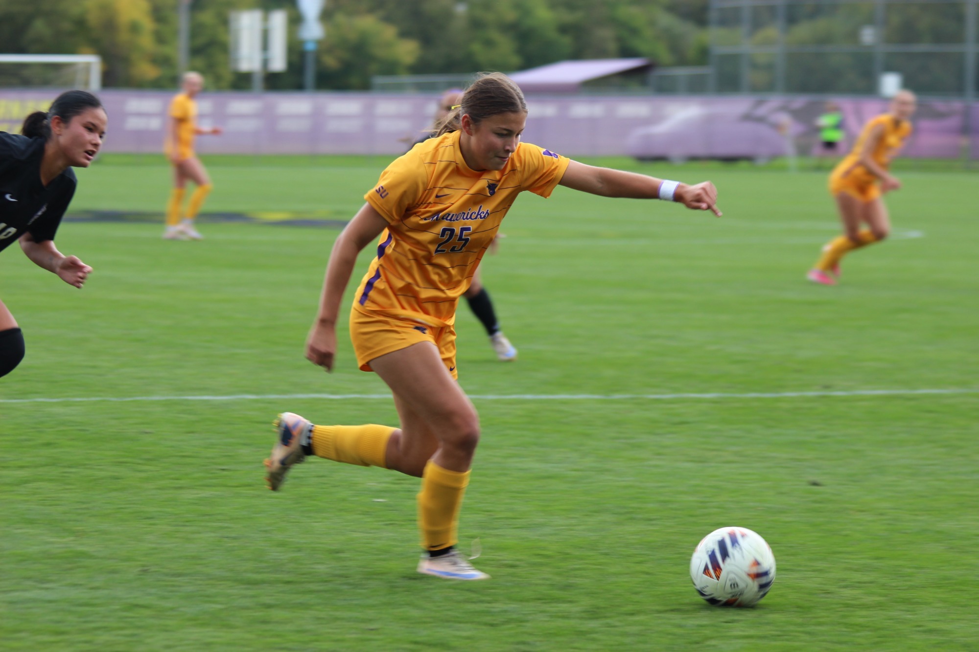 Teagan Jurek loads up to kick the soccer ball