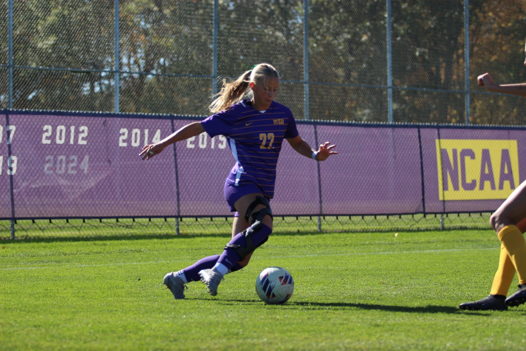 Marin Johnson dribbles the ball past a defender