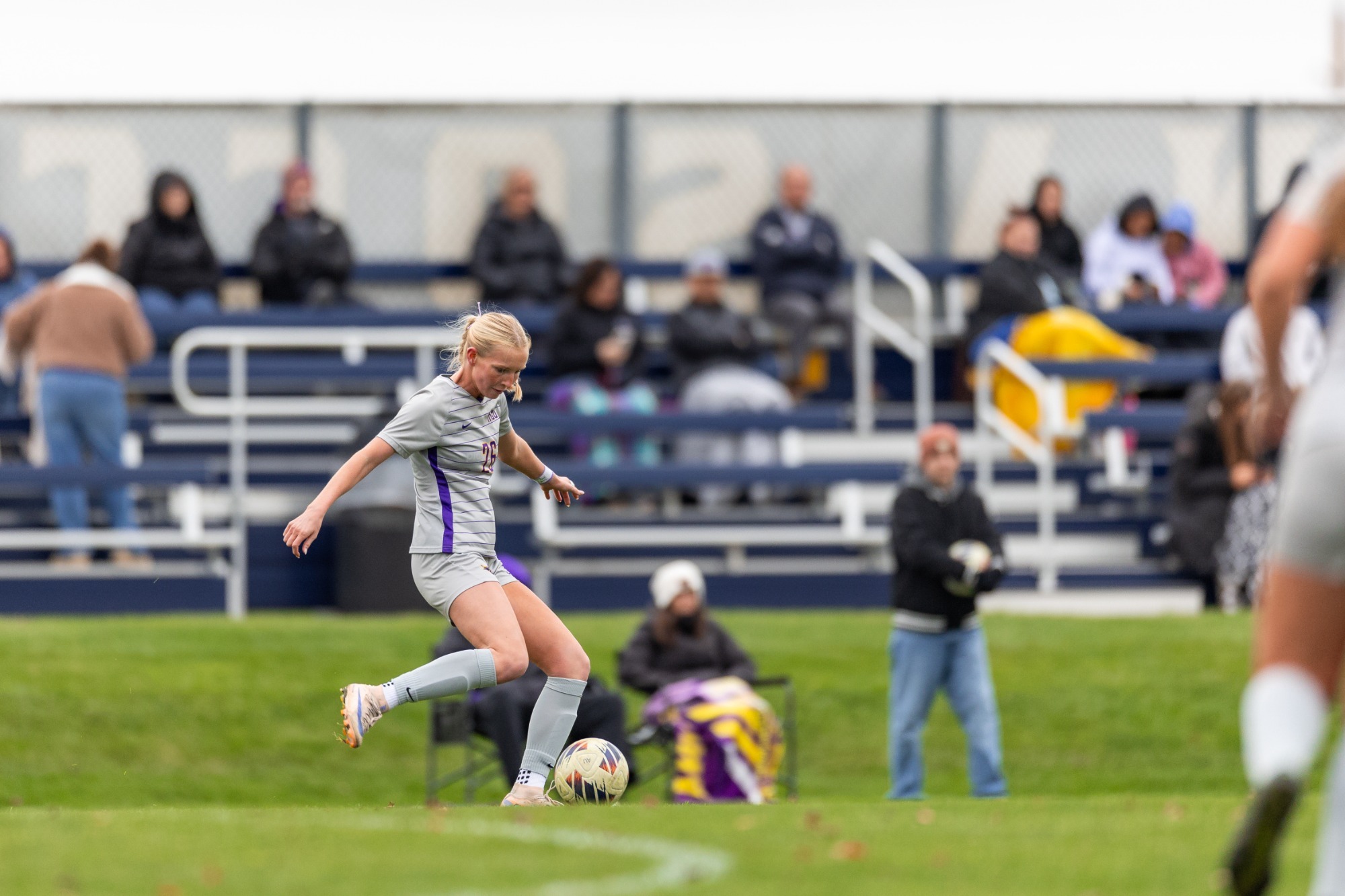 Evie Burk kicks the ball vs. Augustana