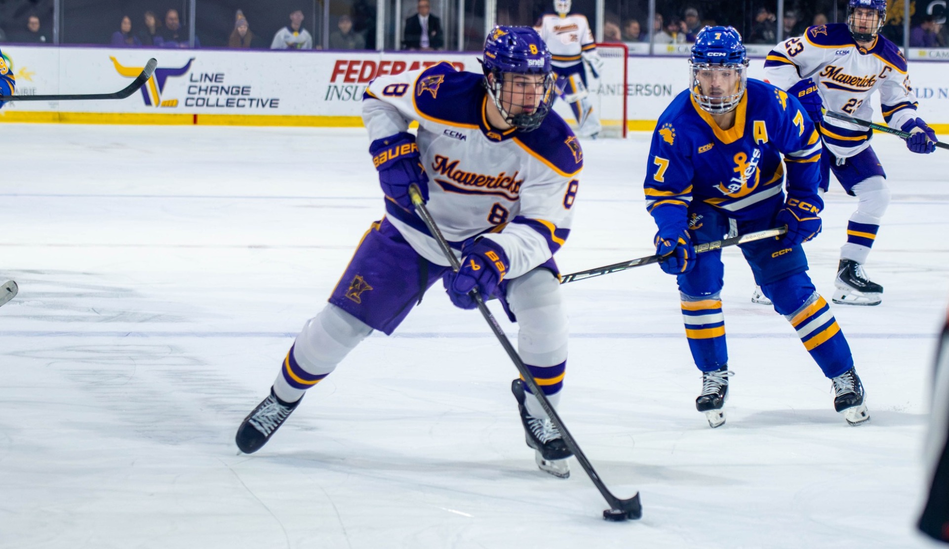 Will Skahan with the puck against Lake Superior State