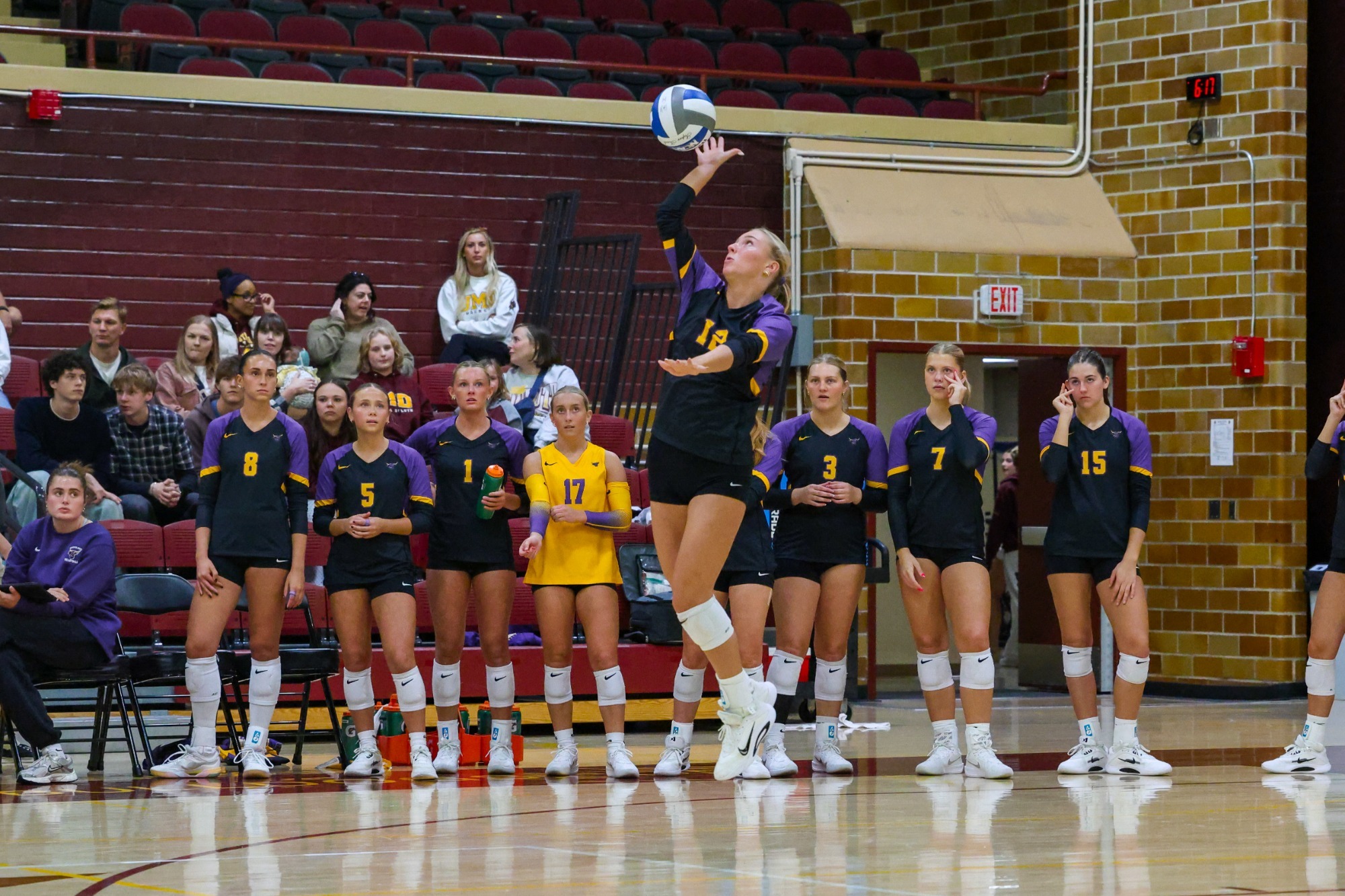 Kaelyn Wieland serving