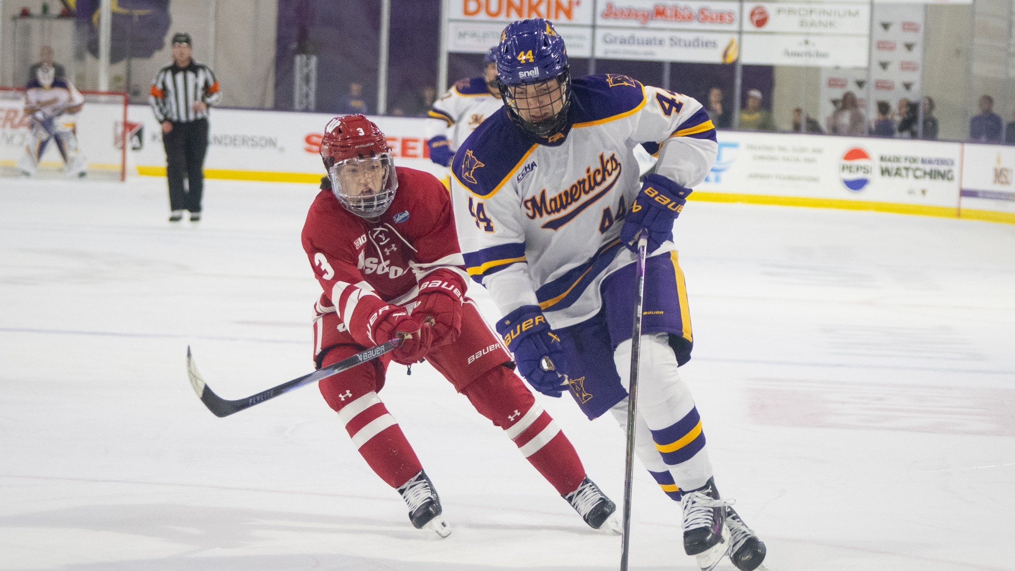Reid Morich brings the puck up the ice in MSU's game against Wisconsin (10.9)