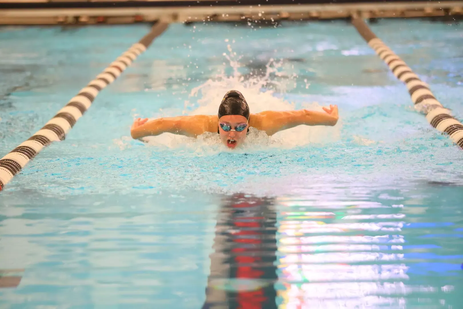 Savannah Acker swimming in the 200 IM at the NSIC Championships