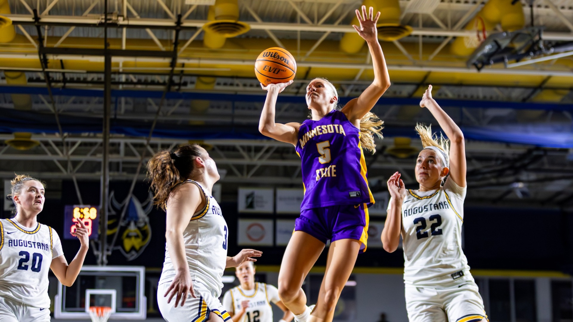 Natalie Bremer goes up for a layup while playing at the Elmen Center against Augustana