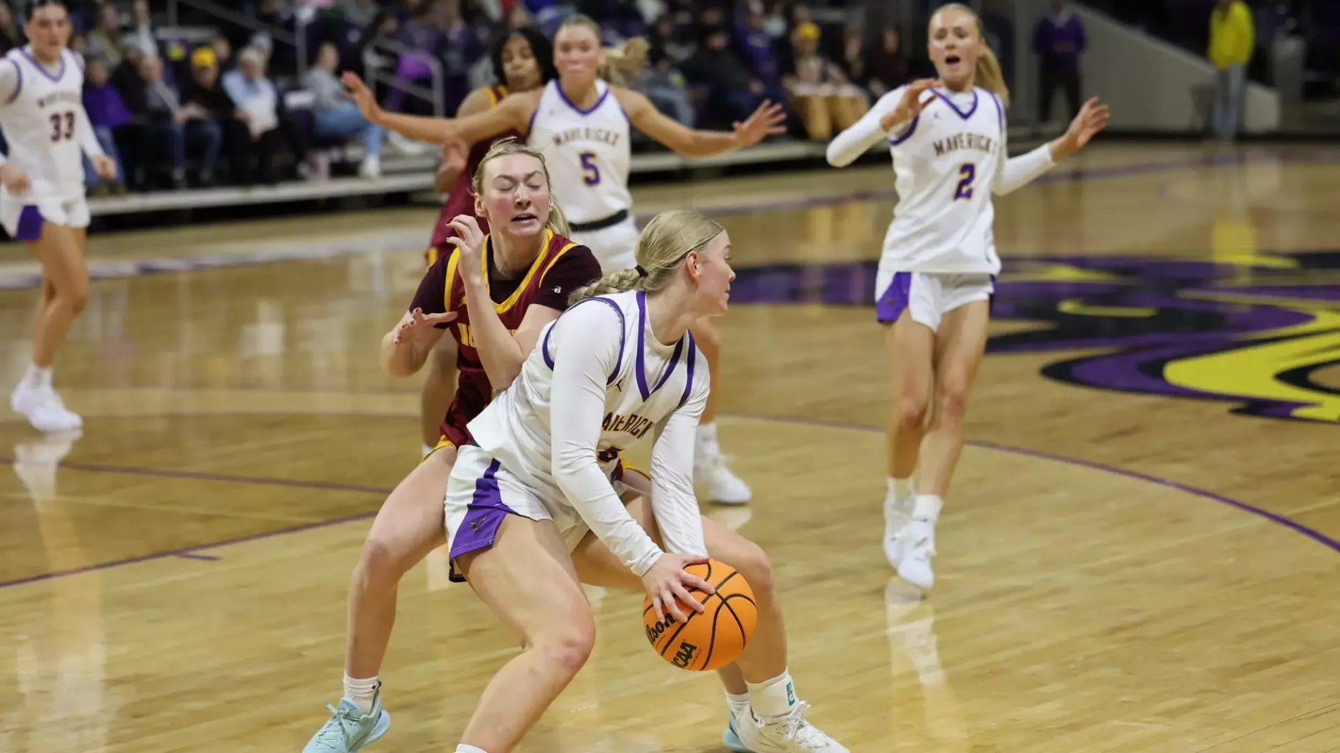 Rhyan Holmgren trys to find someone to pass to in the game against Northern State