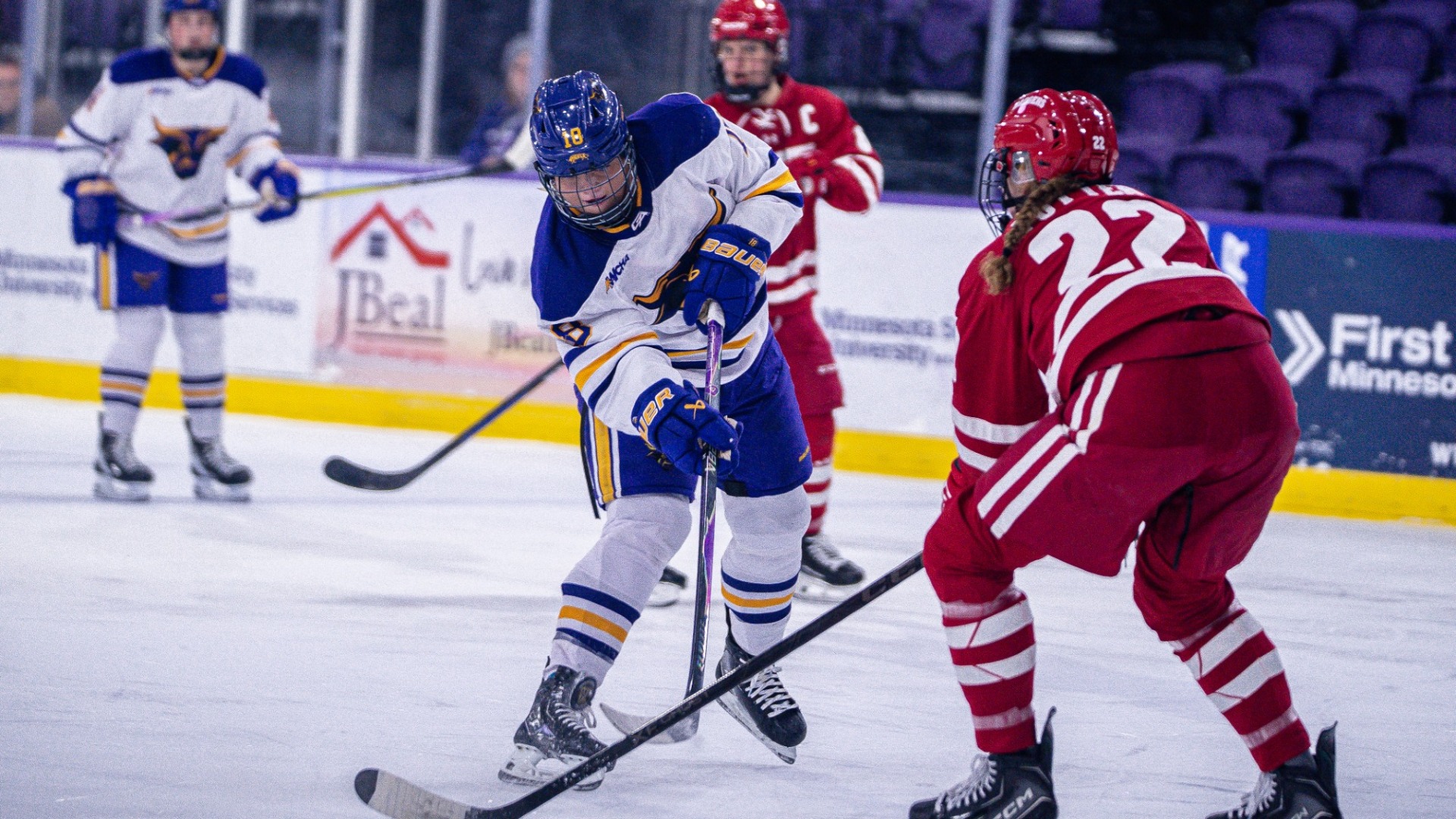 Makayla Moran shooting the puck vs #1 Wisconsin Badgers 
