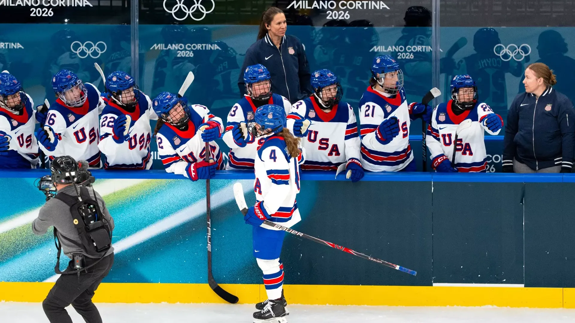 Shari Dickerman watches as Team USA celebrates a goal during the 2026 Winter Olympics in Milan