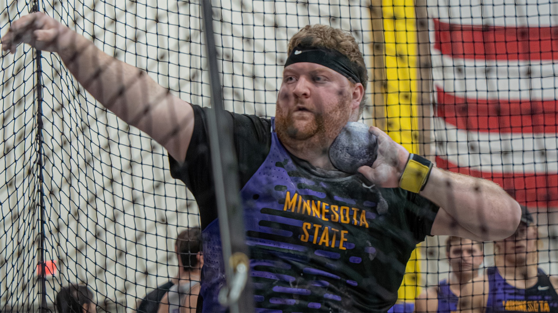 Ben Wieser ready to throw shot put indoors