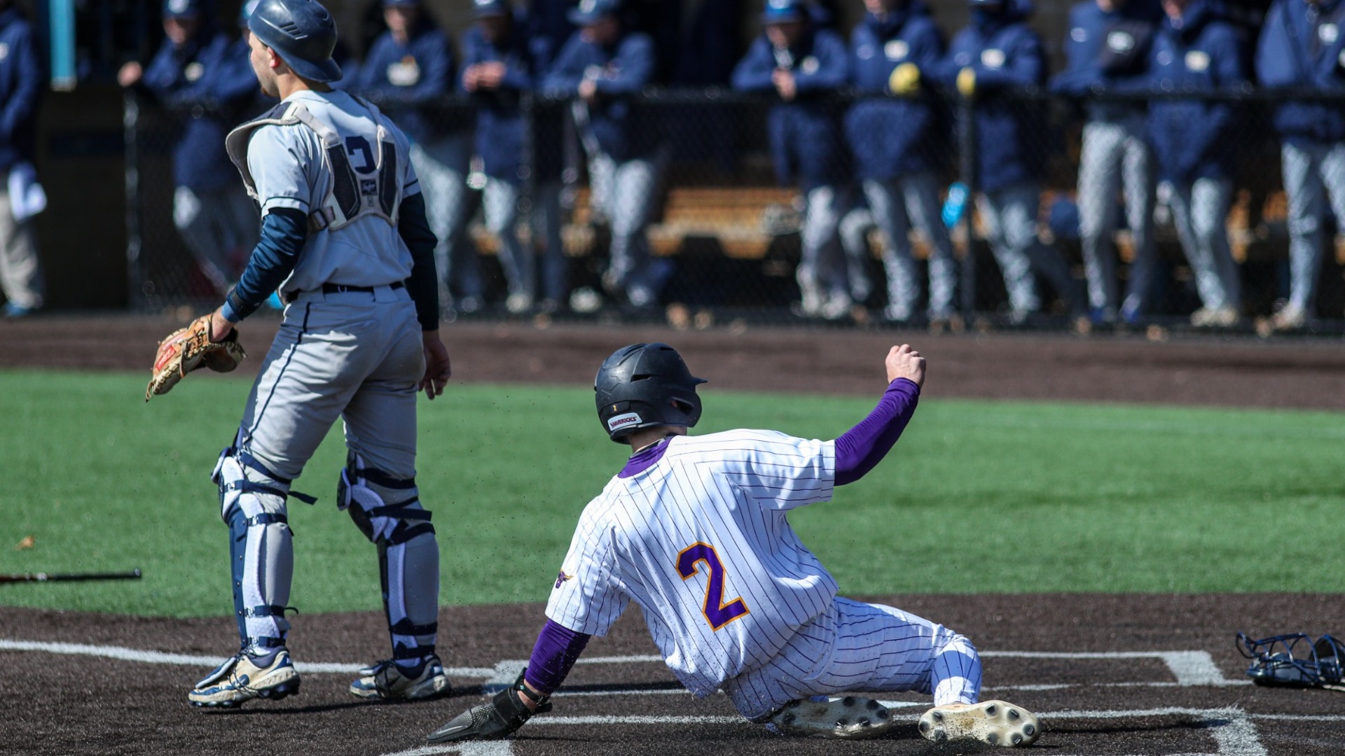 Jake Berkland sliding into home base vs Concorida St-Paul