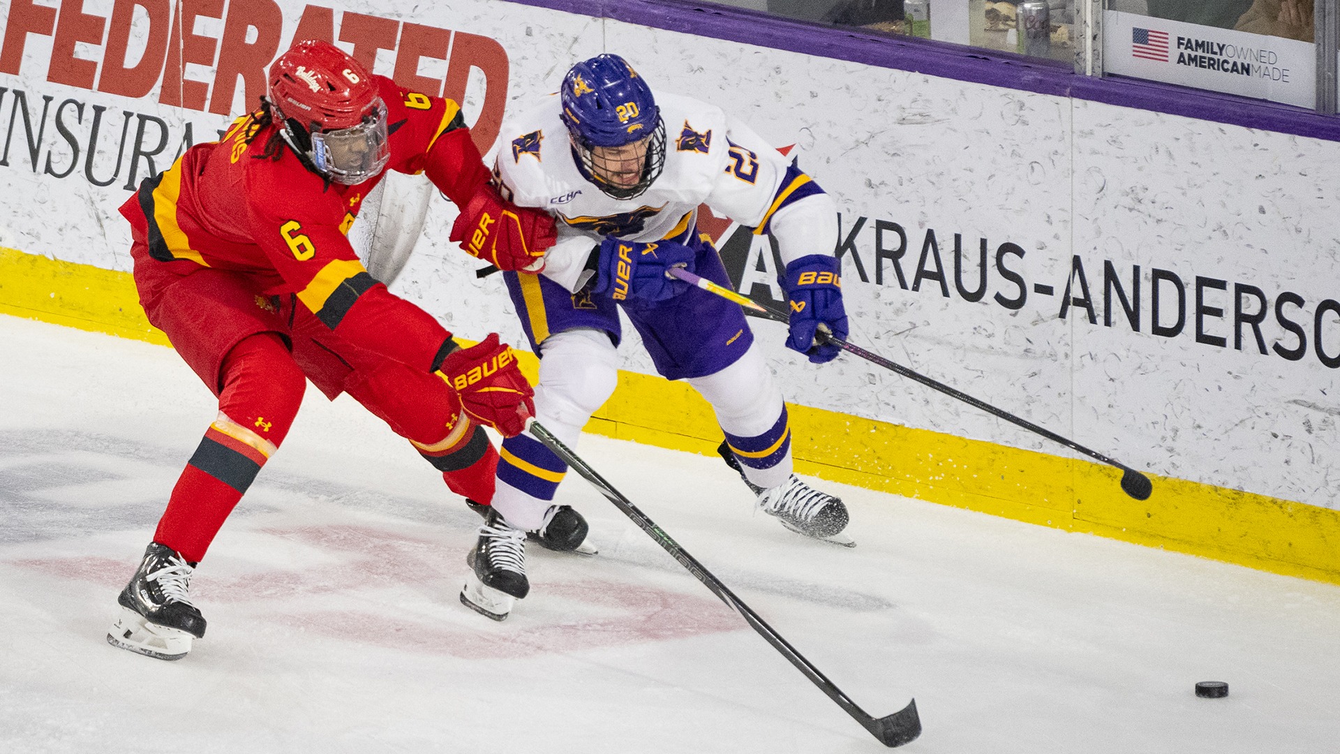 Jack Smith fights for puck possession vs. Ferris March 6