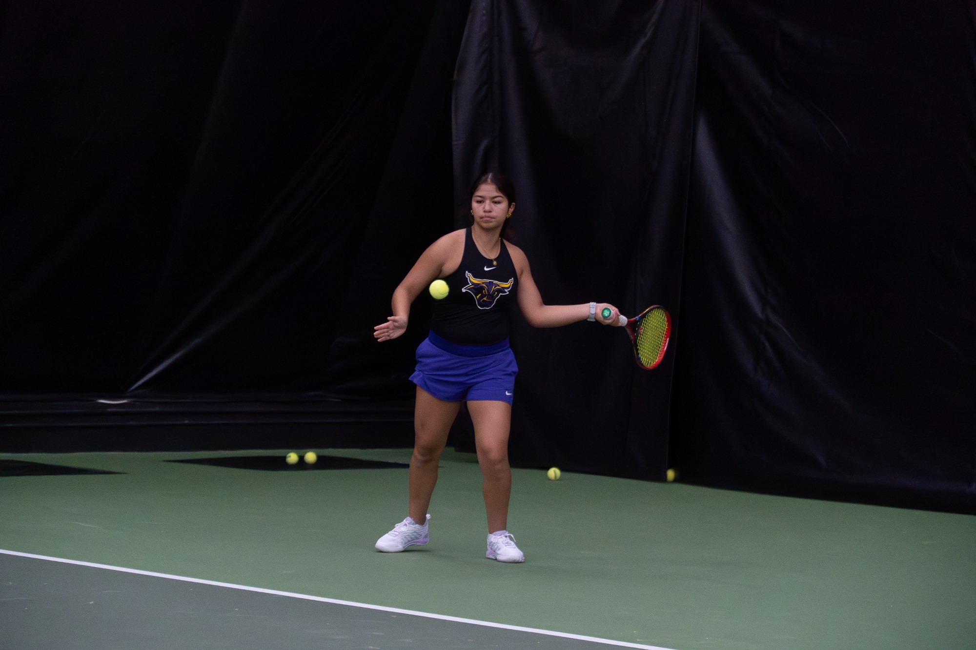 Alma Vazquez swinging at the ball